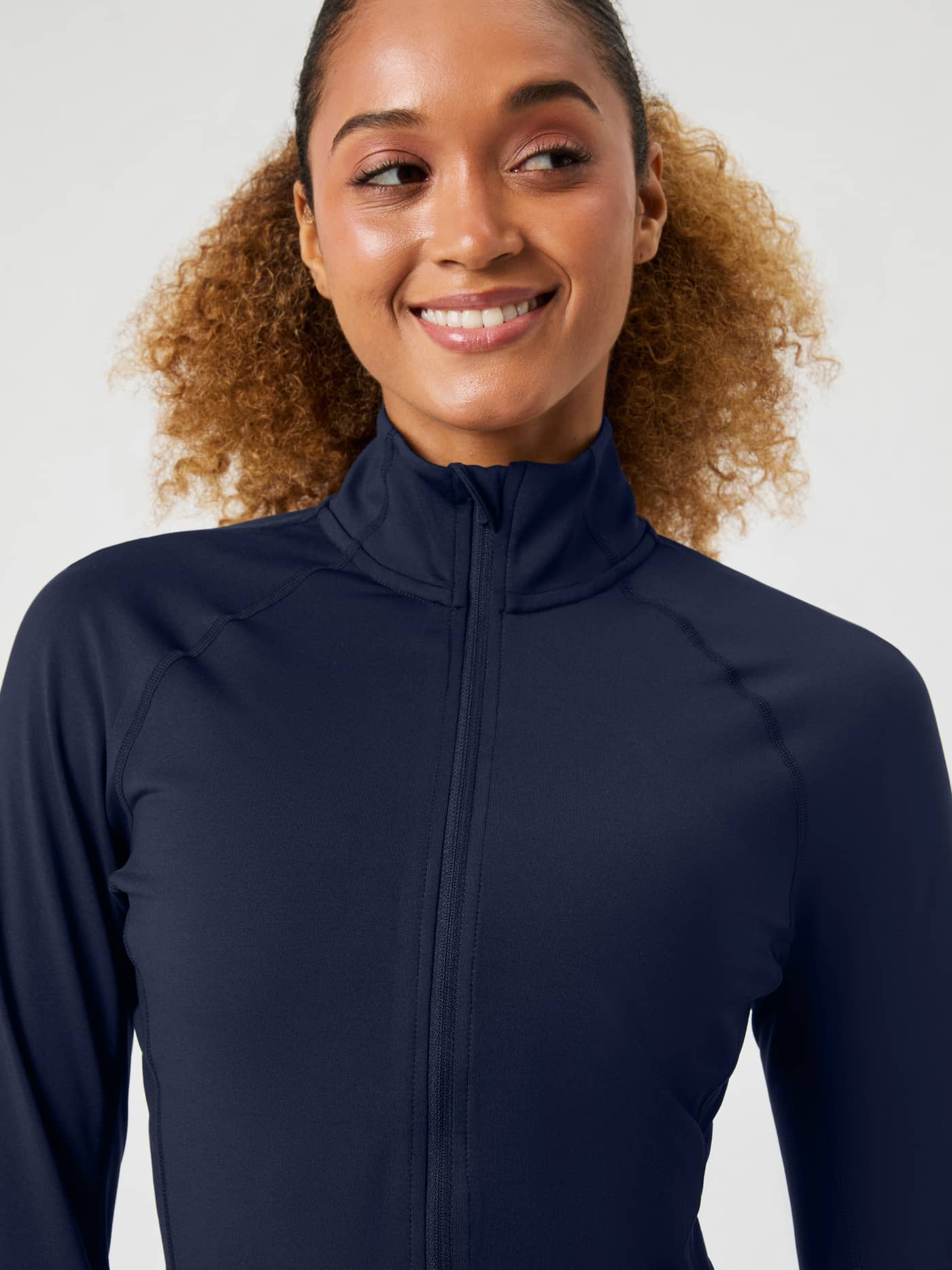 Front view of a model in the slim-fit Borg Full Zip Midlayer in Night sky (Navy), ideal for training sessions. - Image 4