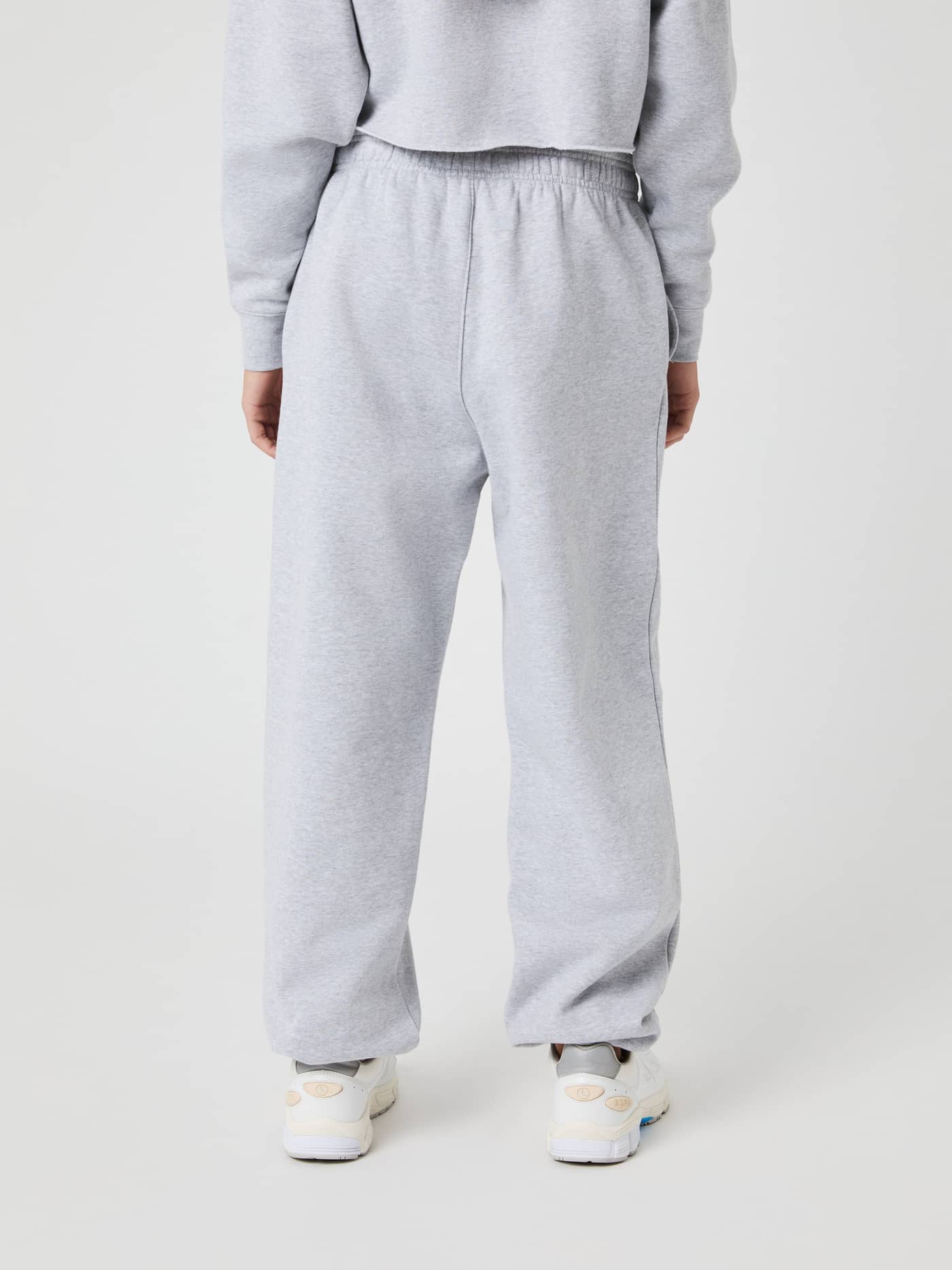 Back view of kids wearing the Björn Borg Oversized Sweatpants in Light Grey Melange (Grey) for a relaxed fit. - Image 2