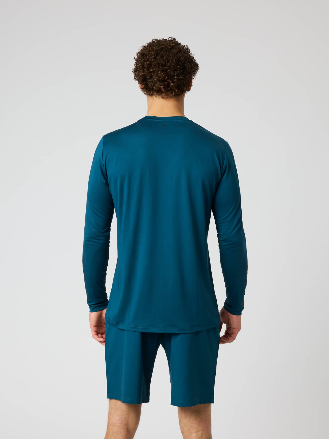 Borg Long Sleeve T-Shirt in Reflecting Pond (Green) shown from the back on a model for performance training. - Image 3