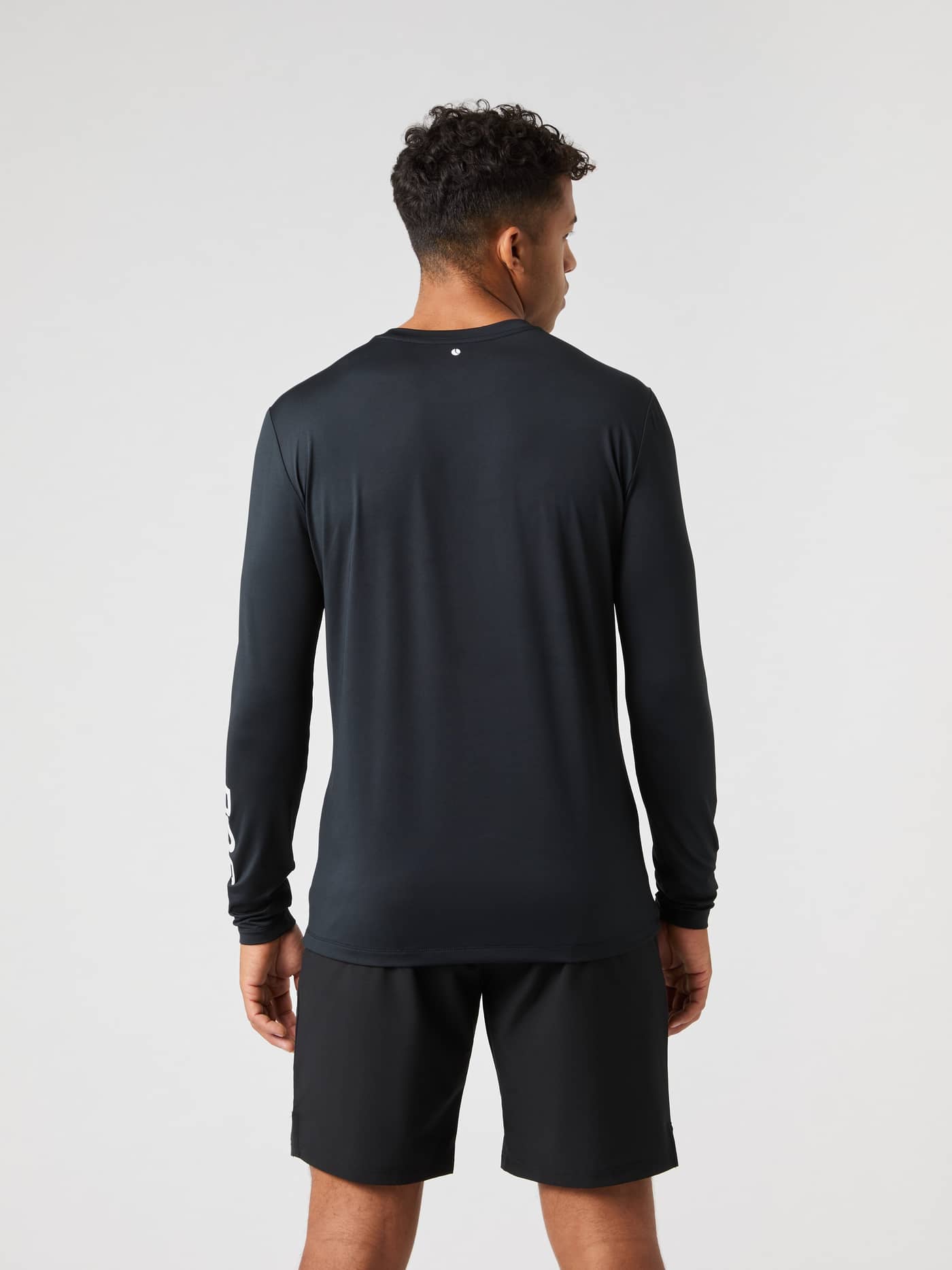 Back view of a model wearing the Borg Long Sleeve T-Shirt in black. - Image 2