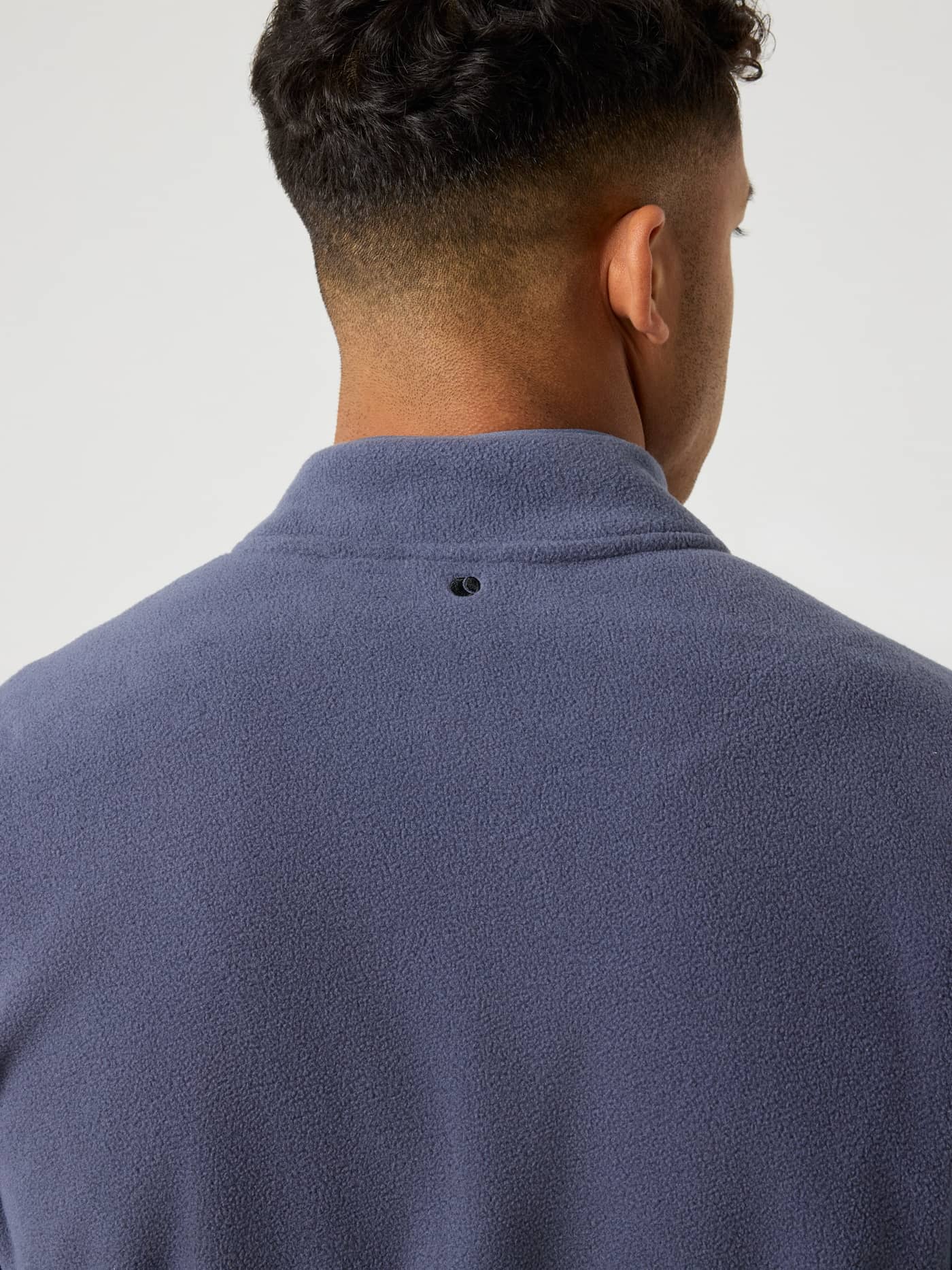 Detailed back view of the Björn Borg Half Zip Fleece in Odyssey Gray (Blue) with tennis ball embroidery at the neck. - Image 6