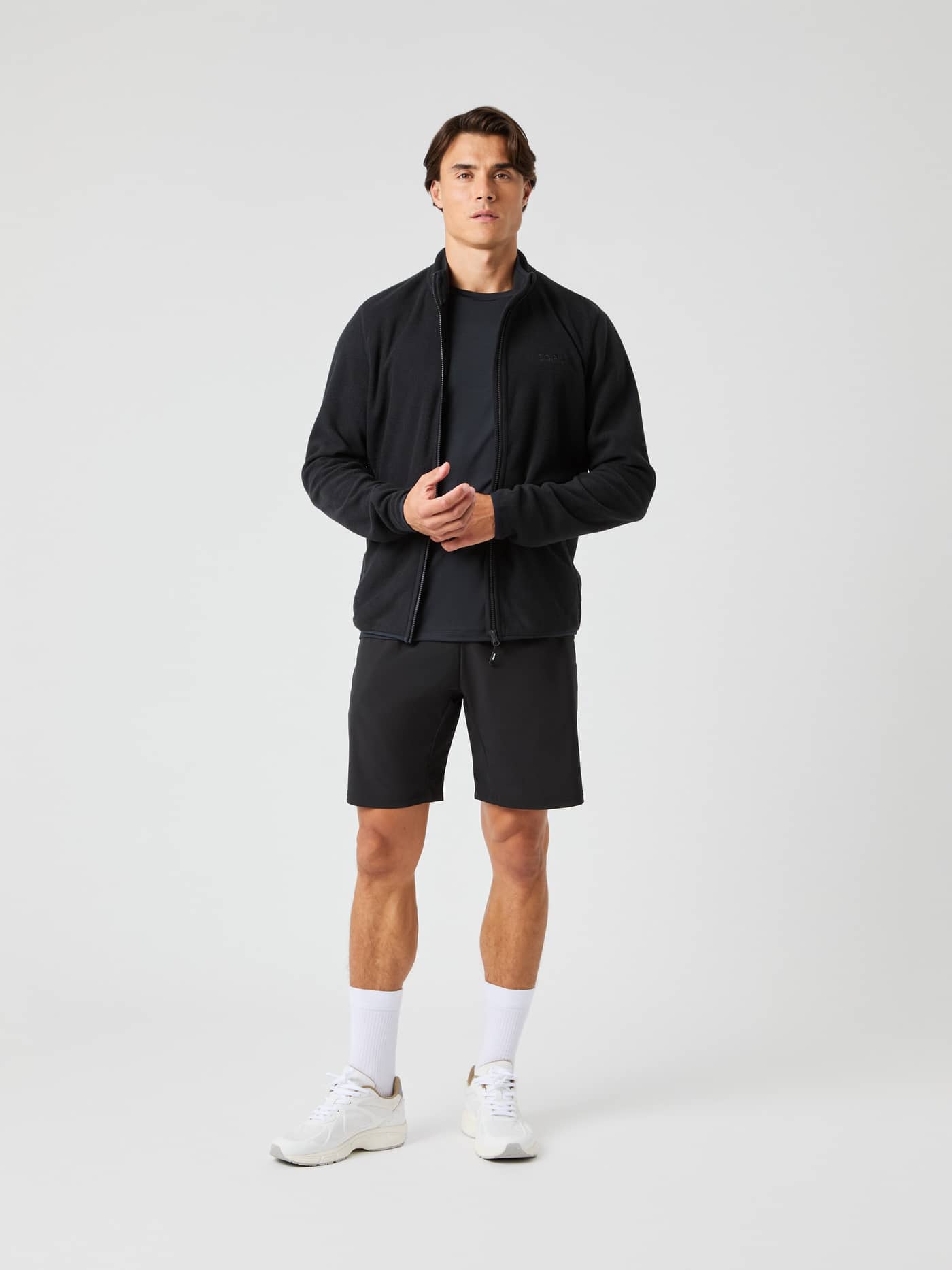 Full-body front view of a man wearing the Borg Full Zip Fleece in Black Beauty (Black), a functional fleece midlayer. - Image 3