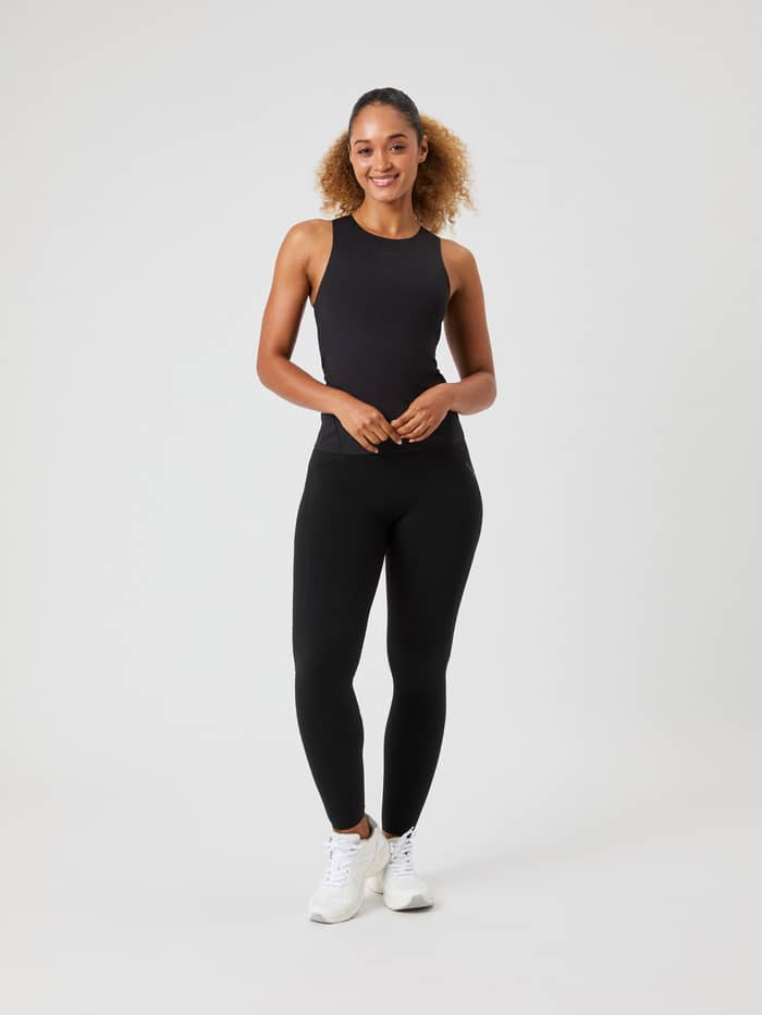 Full-body front view of a woman wearing the Björn Borg 2 In 1 Tank Top in Black Beauty (Black) for a stylish training fit. - Image 3