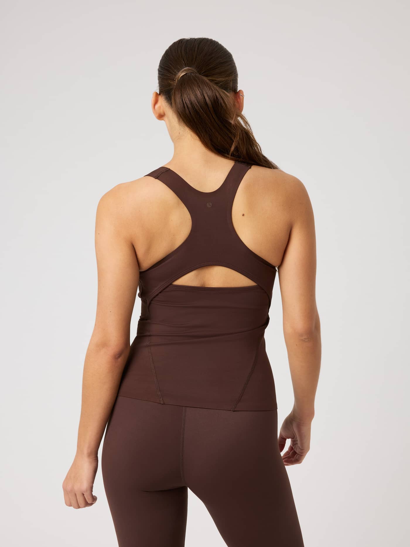 Back view of the Borg 2 In 1 Tank Top in Coffee Bean (Brown) with a racerback, keyhole, and tonal tennis logo for training. - Image 2