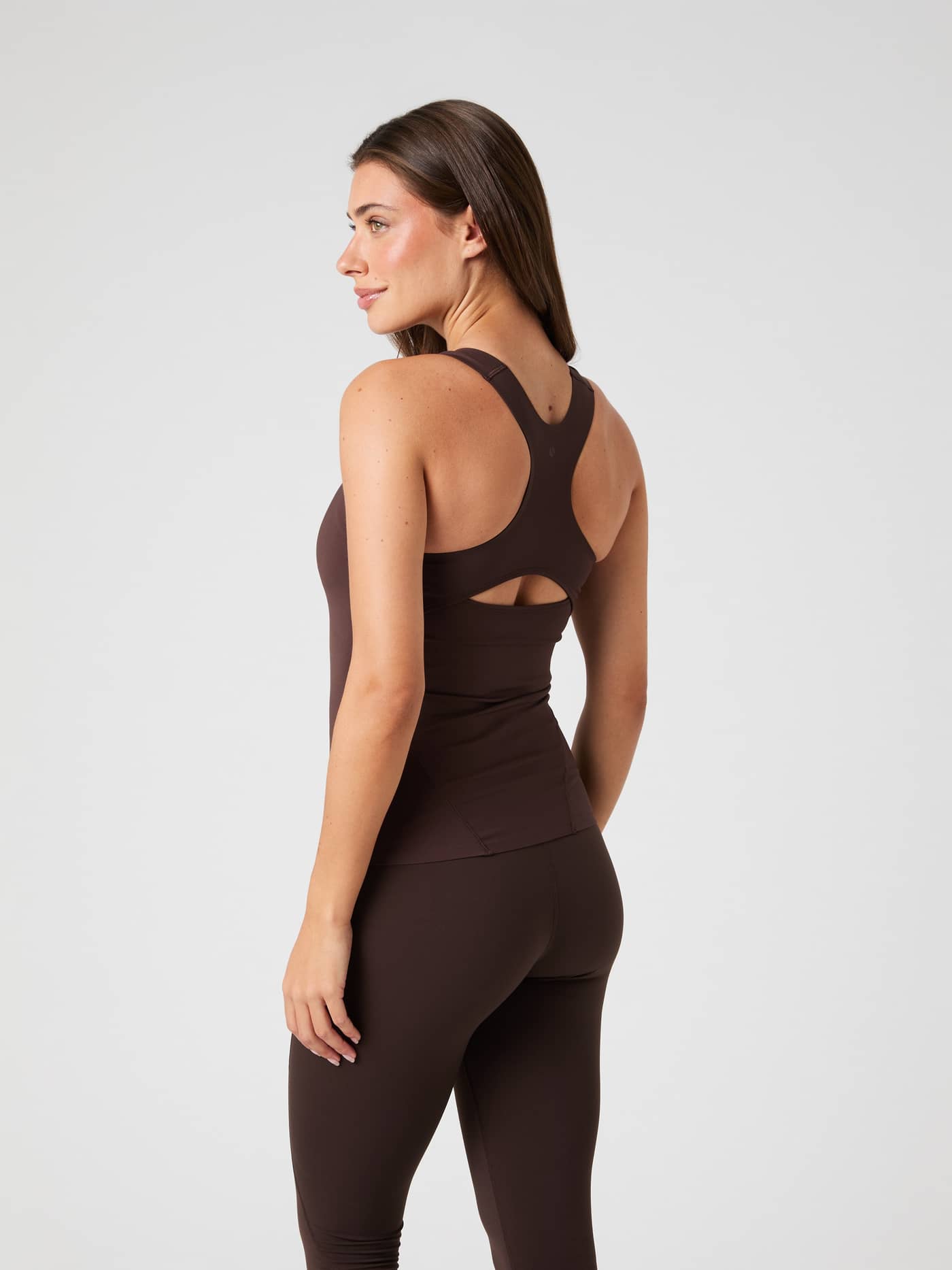 Back view of the Borg 2 In 1 Tank Top in Molé (Brown) for training, featuring a keyhole back and body-hugging fit. - Image 2
