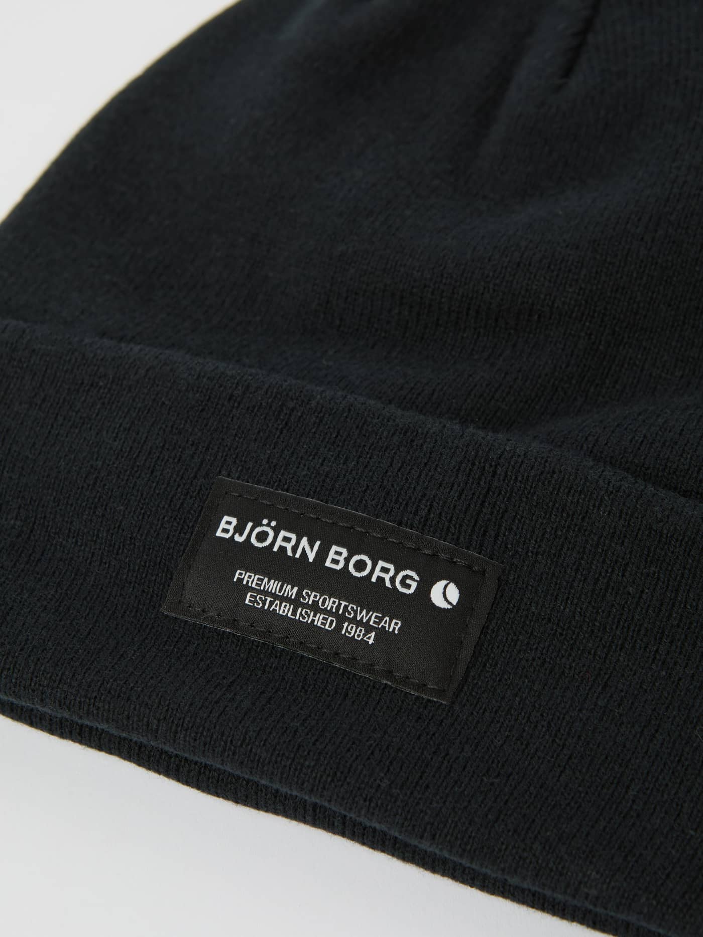 Close-up of the Björn Borg Centre Beanie in Black Beauty (Black), highlighting the organic cotton knit and front label. - Image 2