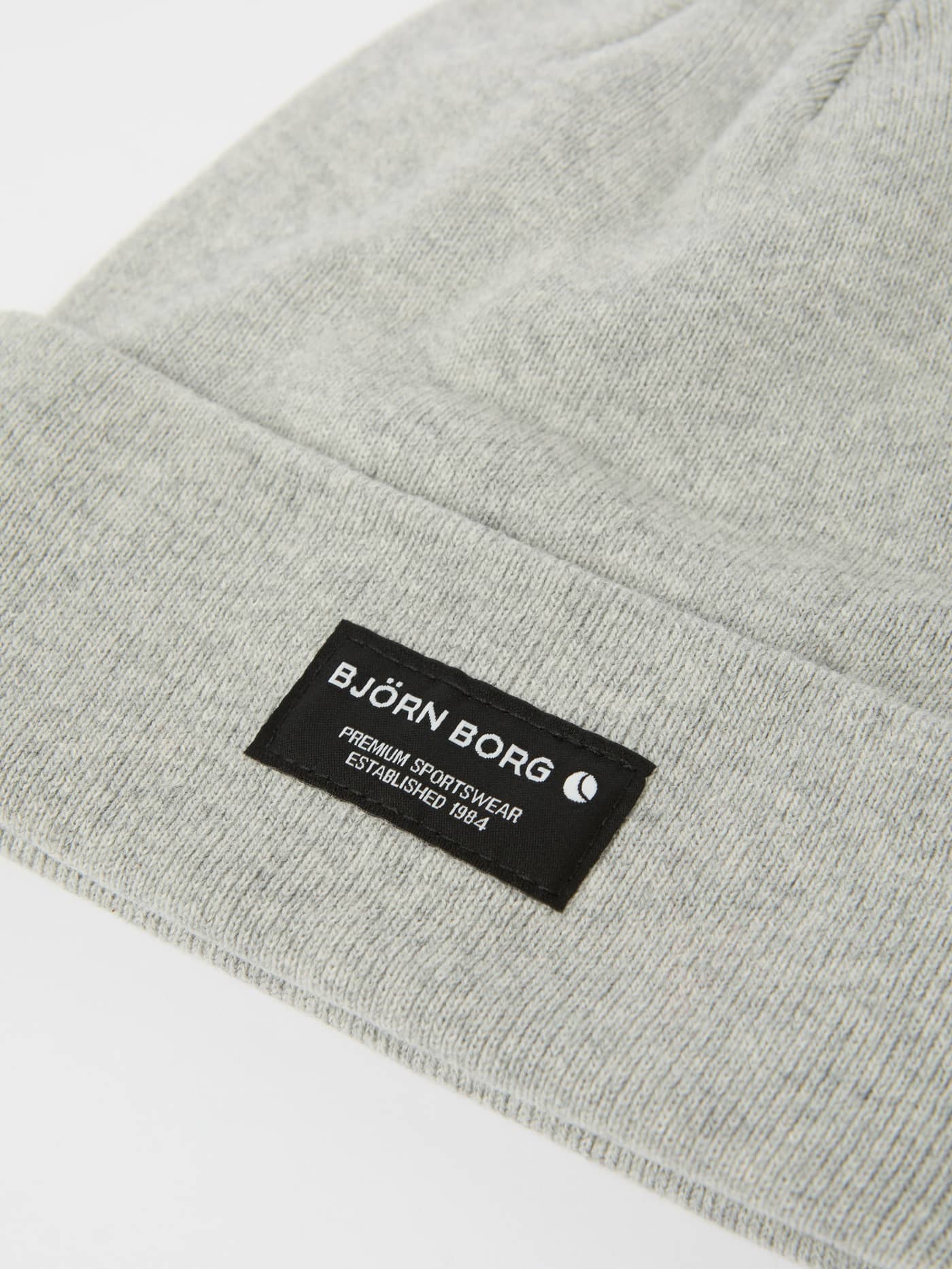 Detailed close-up of the Björn Borg Centre Beanie in Light Grey Melange (Grey), showcasing the organic cotton and logo label. - Image 2
