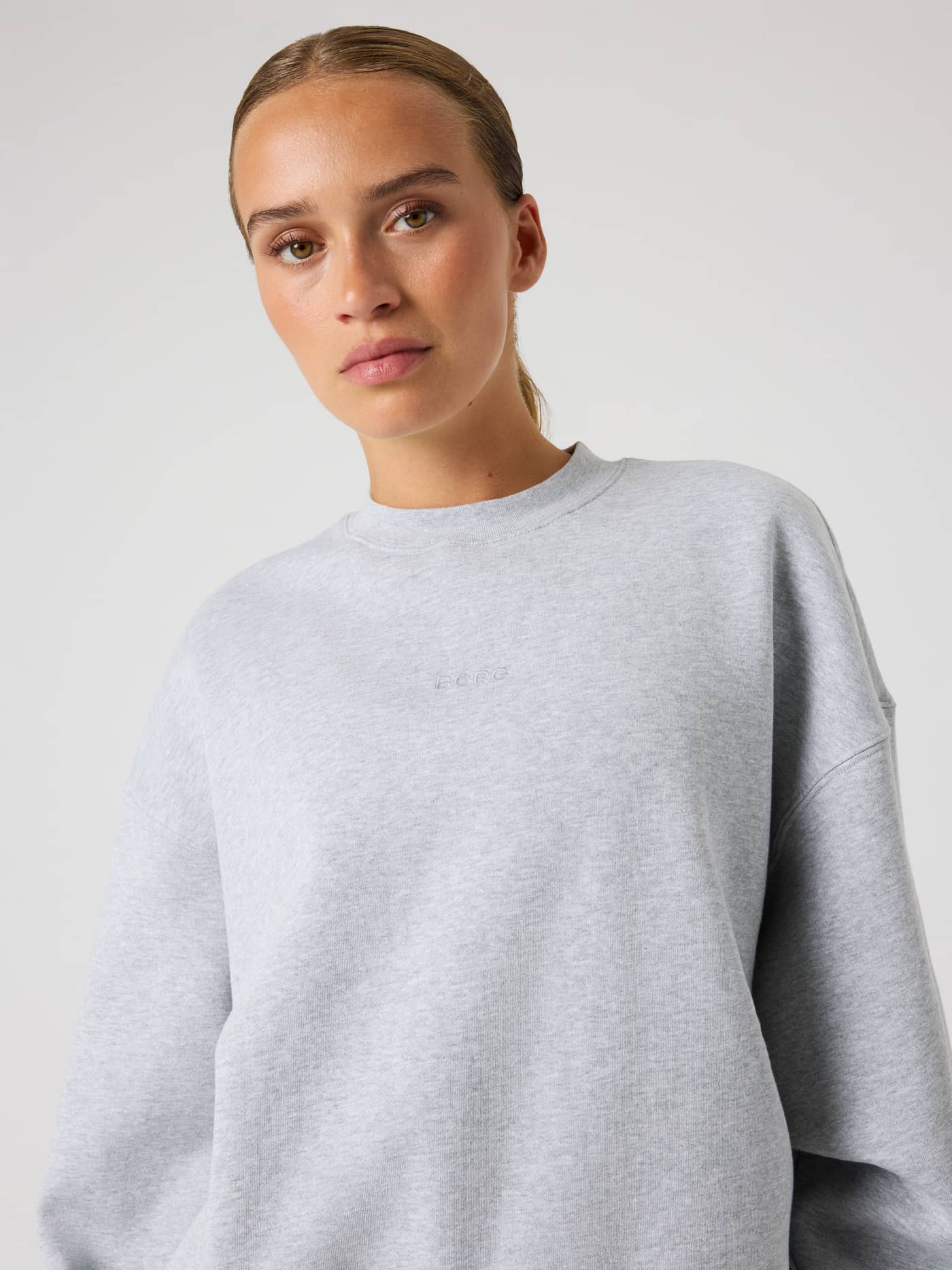 Studio Oversized Sweatshirt in Light Grey Melange (Grey) featuring a relaxed fit and a subtle tonal logo. - Image 5