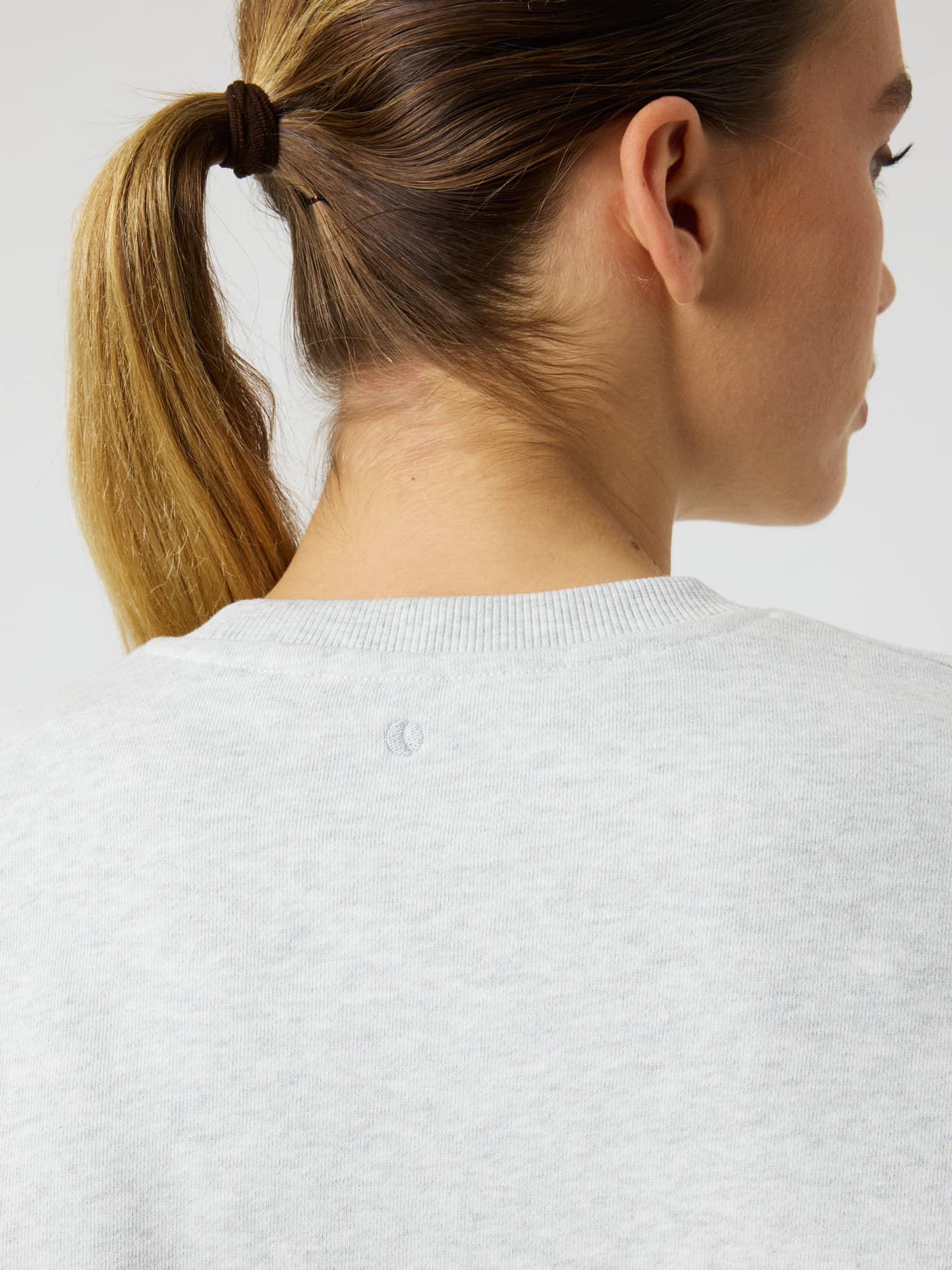 Studio Oversized Sweatshirt in Ultra Light Grey Melange (Grey) with a tonal tennis ball detail on the back neck. - Image 5