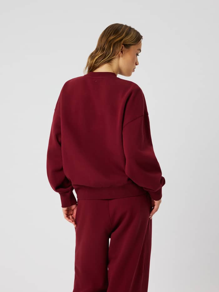 Back view of the Studio Oversized Sweatshirt in Cabernet (Red) featuring a crew neck and relaxed dropped shoulders.