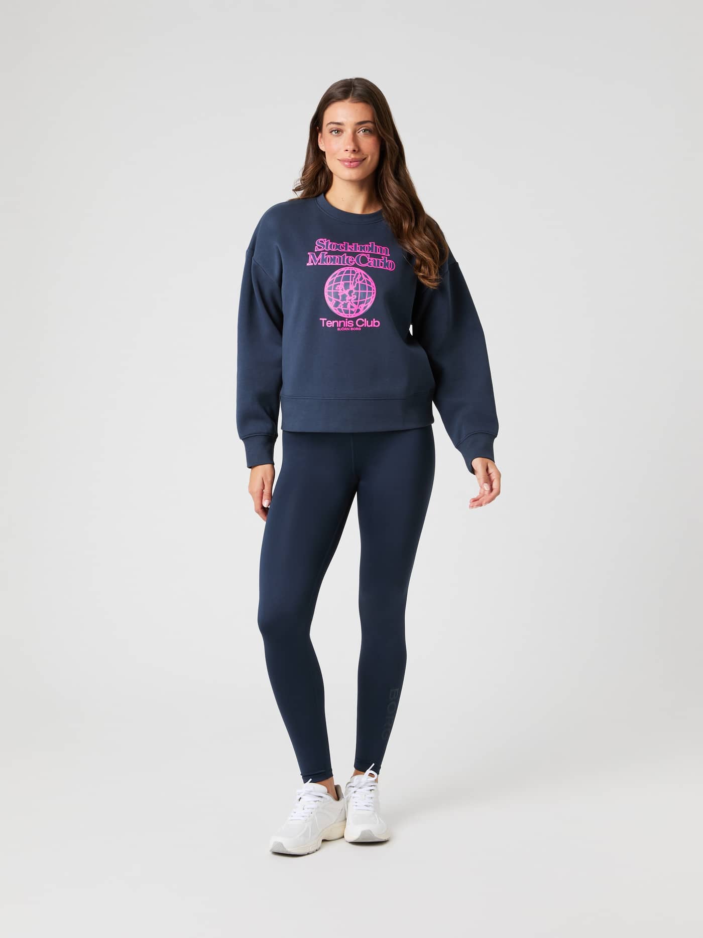 Full-body front view of a model in the Borg Boyfriend Sweatshirt in Outerspace (Navy), featuring a pink tennis graphic. - Image 4