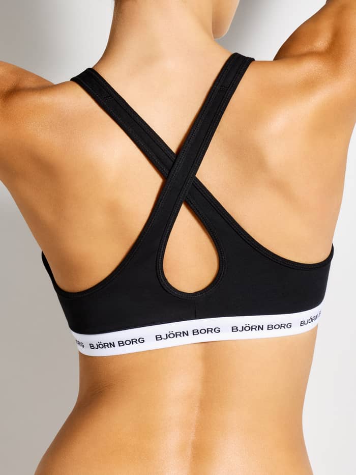 Back view of the women's black Logo Bralette, featuring a stylish crossed back and white elastic with a black logo. - Image 2