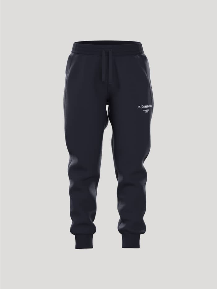 Borg Essential 1 Sweatpants för barn i Night sky (Marinblå) sedda framifrån med vit logotyp och avsmalnande passform.