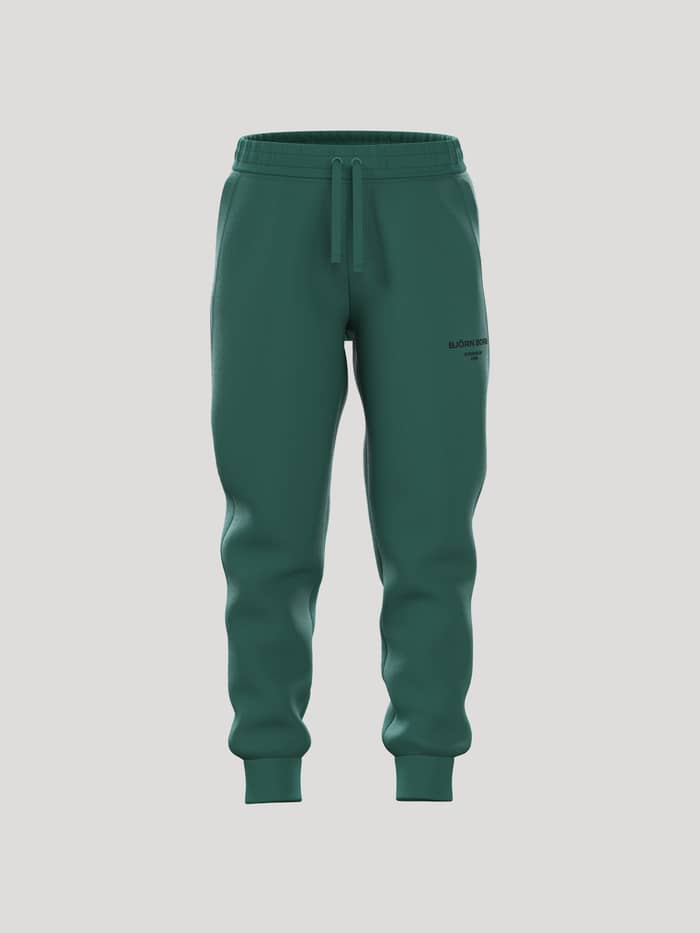 Borg Essential 1 Tapered Sweatpants för barn i Posy Green (Grön) sedda framifrån i en mjuk bomullsblandning.