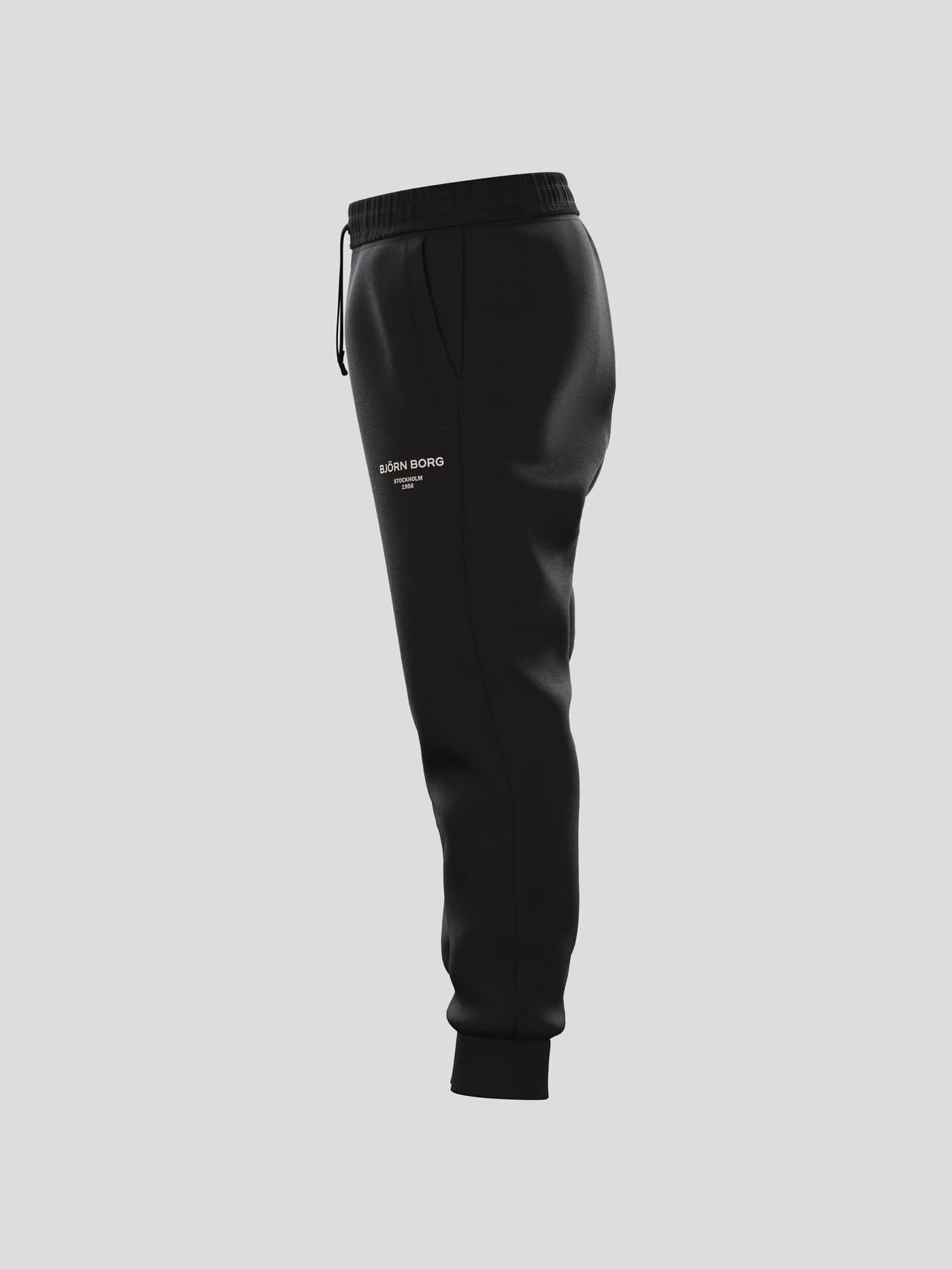 Vista lateral de Borg Essential 1 Sweatpants en Black Beauty (Negro) de algodón para niños, ajuste relajado y logo blanco. - Image 4