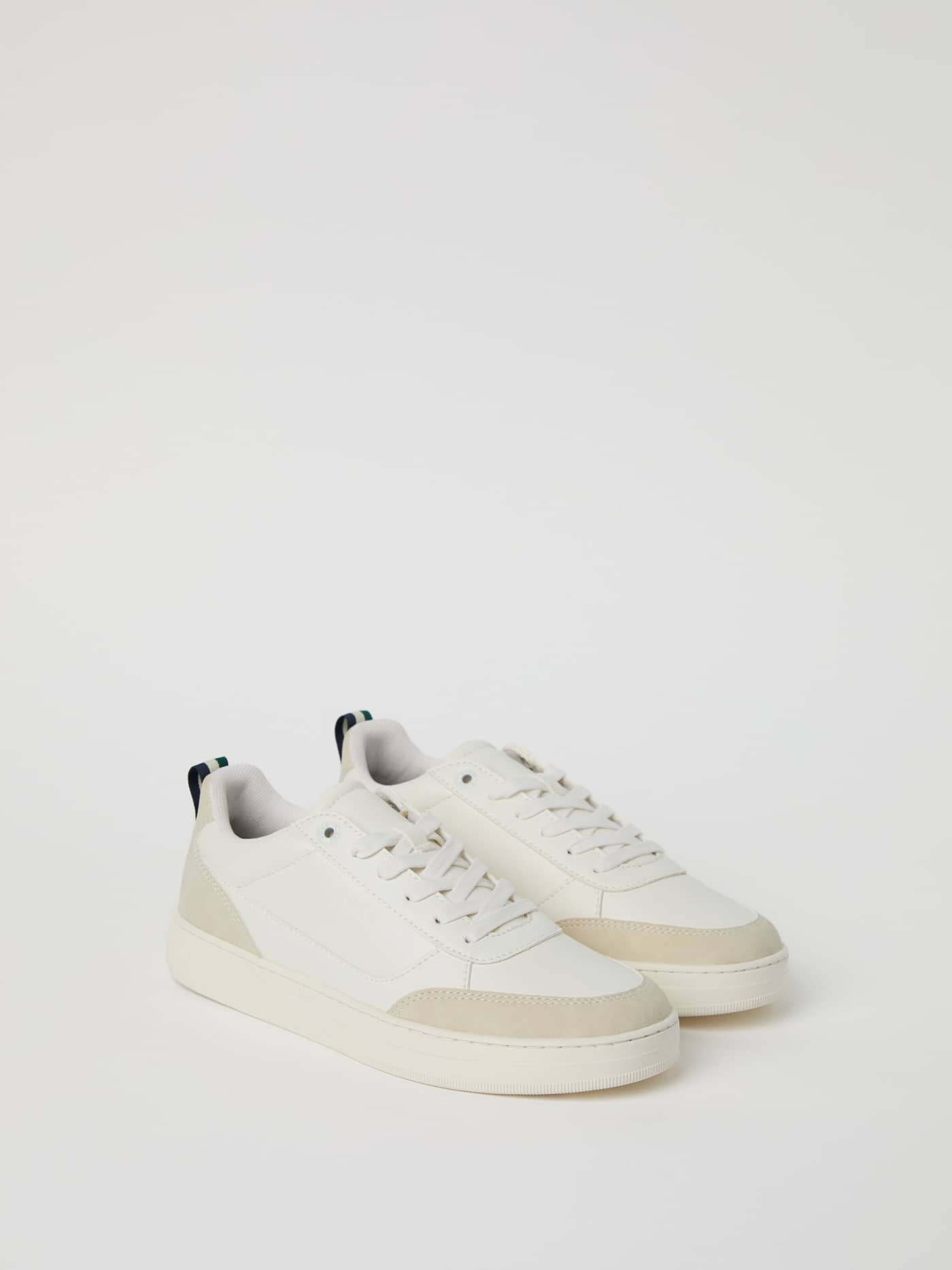 Three-quarter view of the Men's Game Low Sneakers in White, a synthetic leather shoe featuring a tennis-inspired design. - Image 1