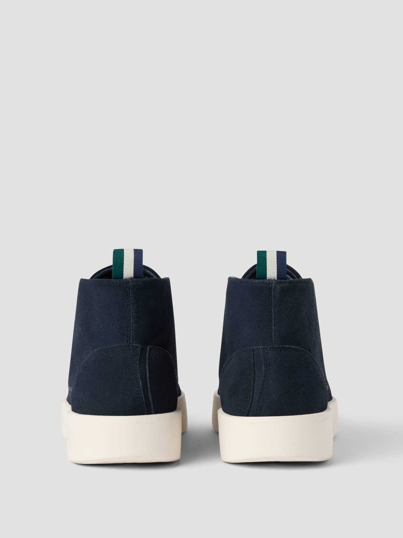 Back view of the Men's Desert Chukka Sneakers in Navy suede, highlighting the refined fit and striped pull tabs. - Image 3