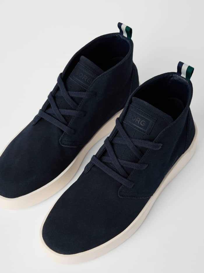 Angled view of navy Men's Desert Chukka Sneakers in suede, featuring a tonal BORG logo, refined style, and a comfortable fit. - Image 2