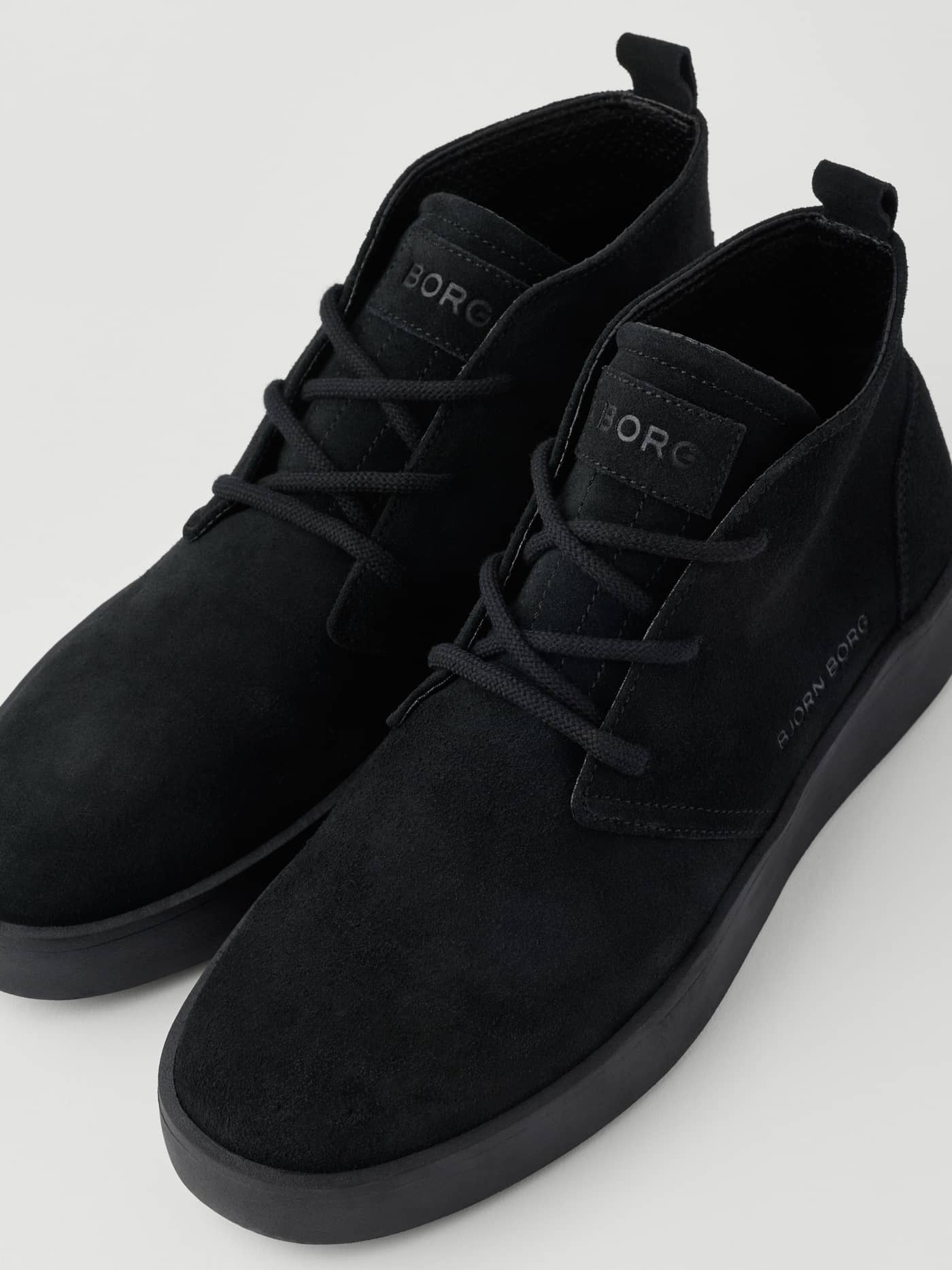 Men's Desert Chukka Sneakers in Black suede with a tennis-inspired silhouette and a tonal black logo on the tongue. - Image 4