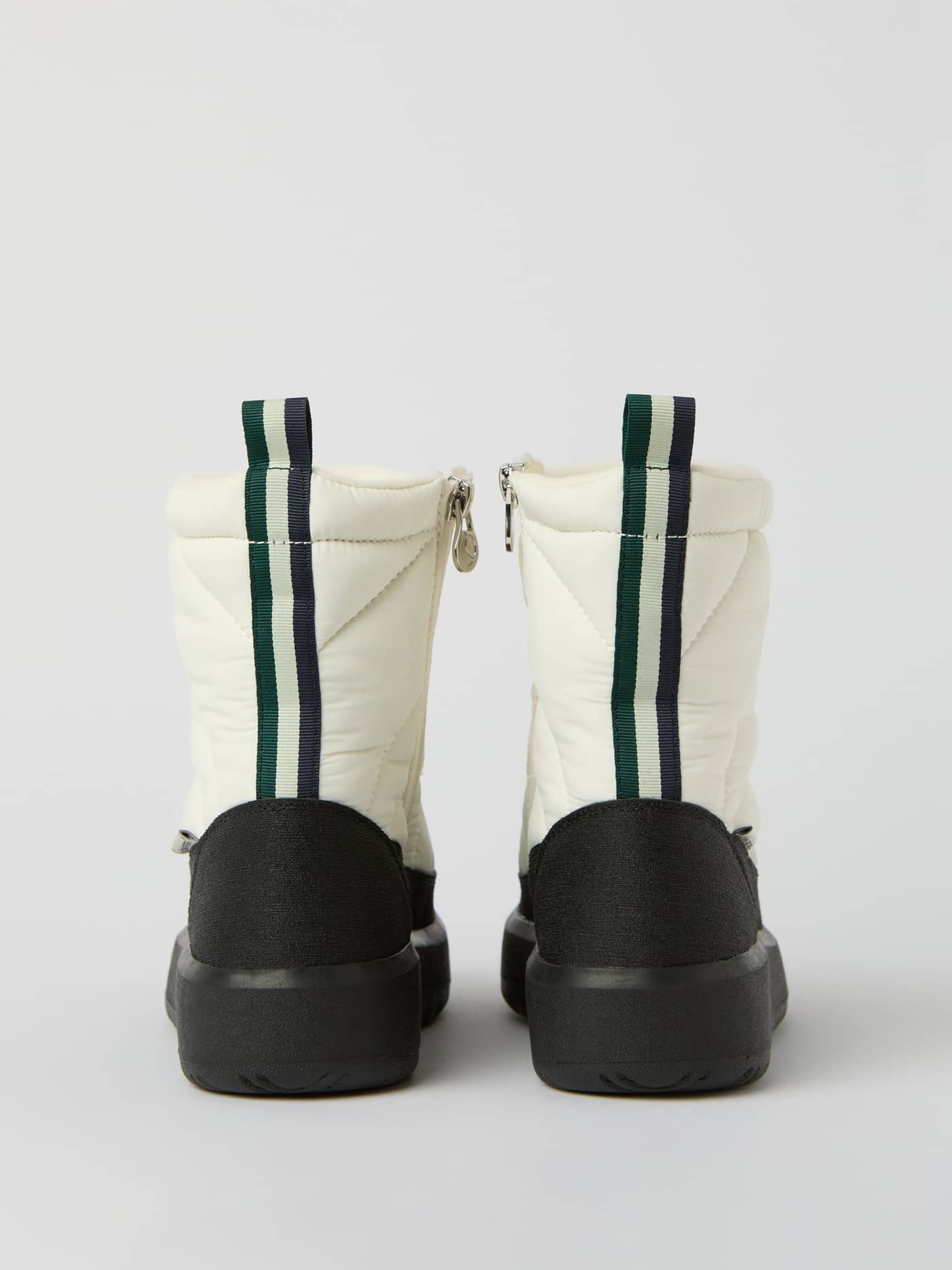 Back view of the Women's Alpine Boots in White, featuring a quilted design and black soles for a stylish leisure fit. - Image 4