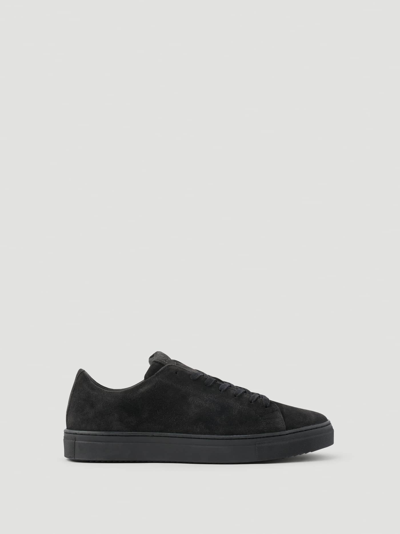 Men's Classic Suede Sneakers in Black, featuring a side view of the premium suede finish and tennis-inspired style. - Image 1