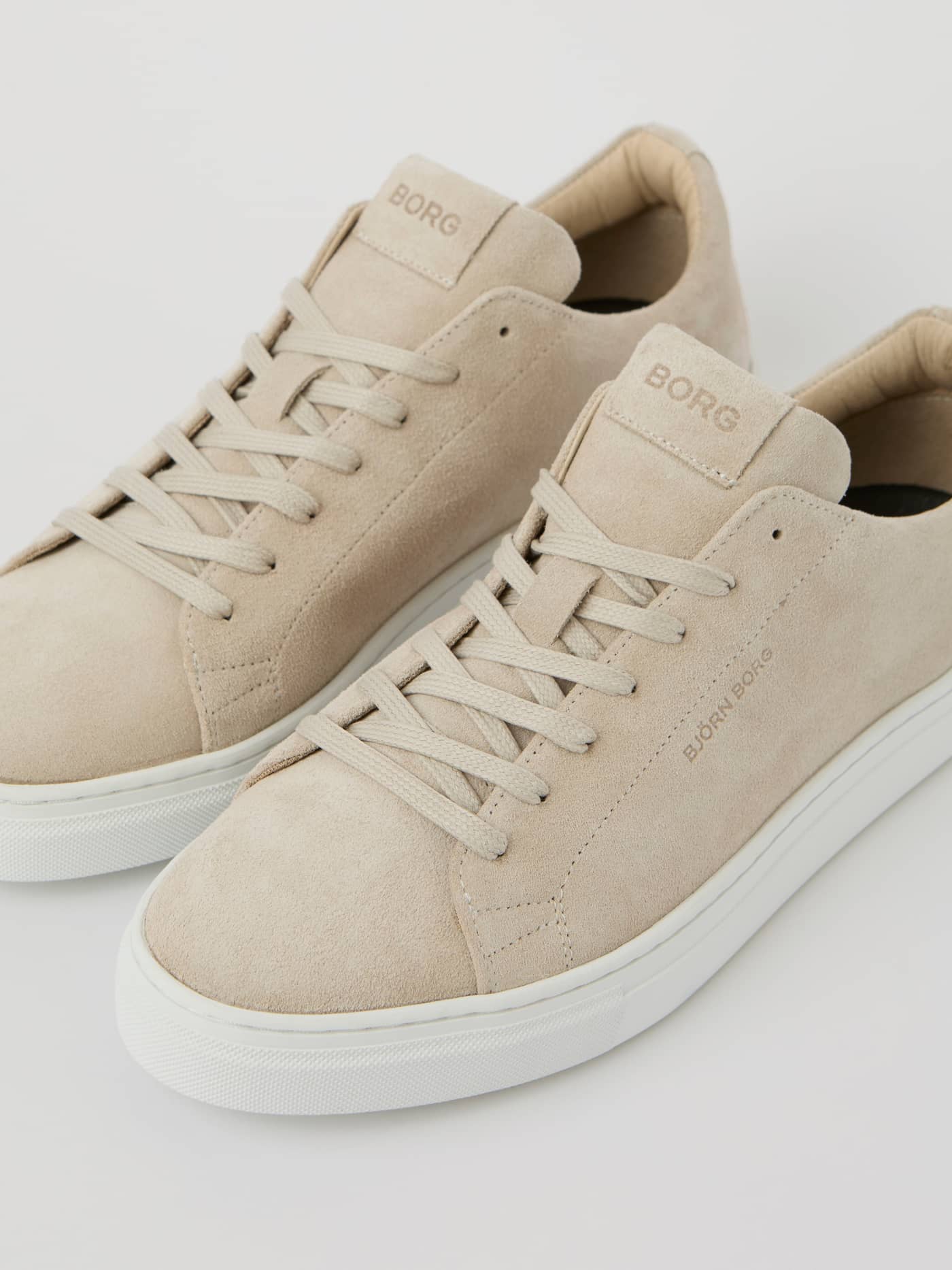 Beige Men's Classic Suede Sneakers featuring tonal logos and a refined fit for a tennis-inspired leisure style. - Image 2