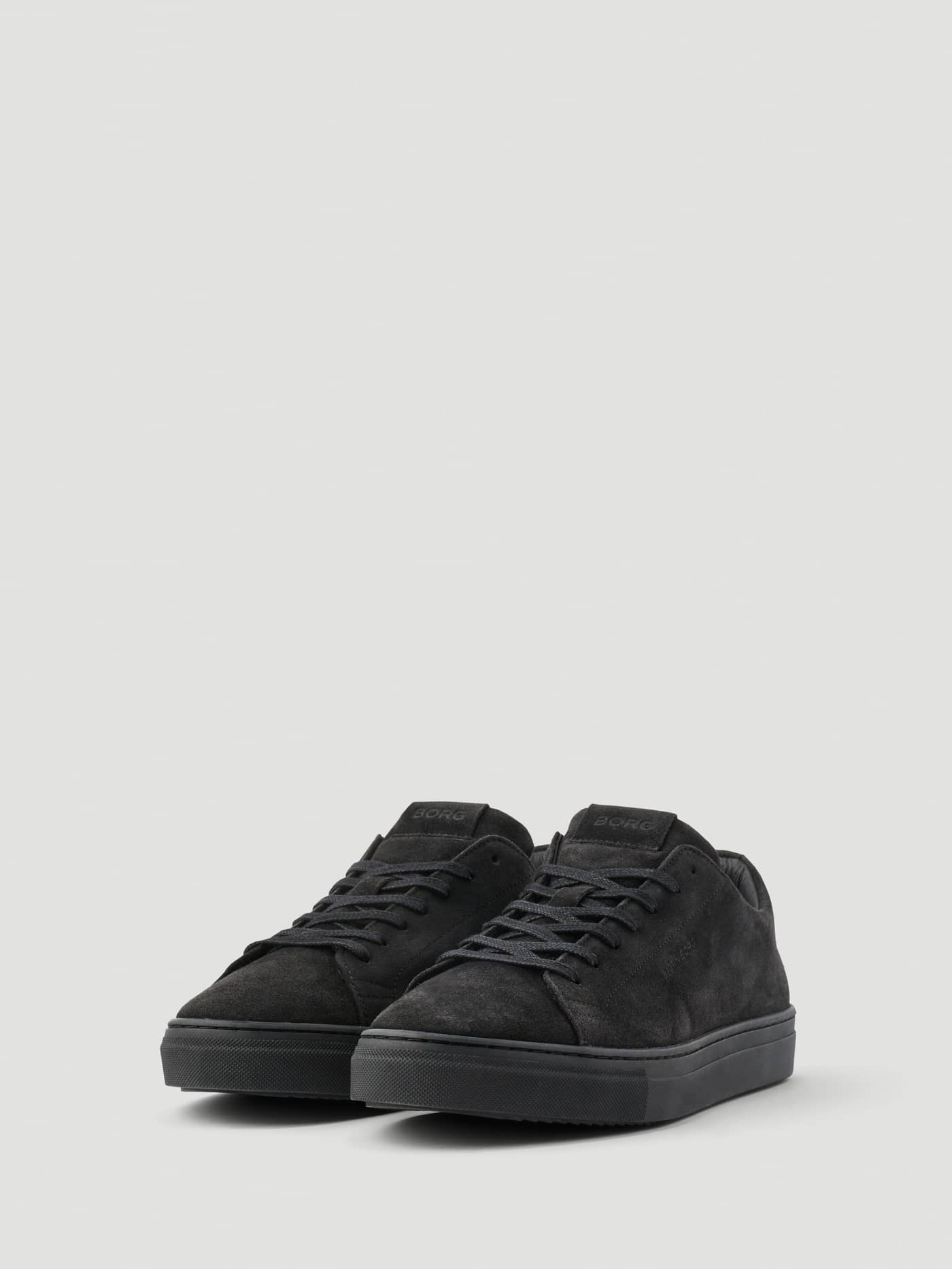 Black Men's Classic Suede Sneakers for tennis featuring a premium suede finish and tonal debossed logo detailing. - Image 2