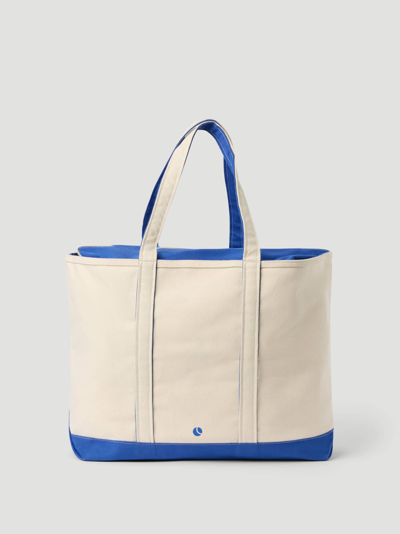 Ace Canvas Tote 30L i Egret (Hvit) for tennis i kraftig bomullscanvas med blå detaljer og liten blå logo. - Image 2