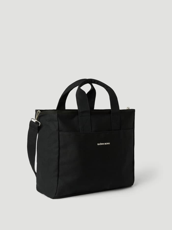 Studio Canvas Tote 34L i Black Beauty (Sort) af bomuldskanvas med hvidt logo og skulderrem. - Image 2
