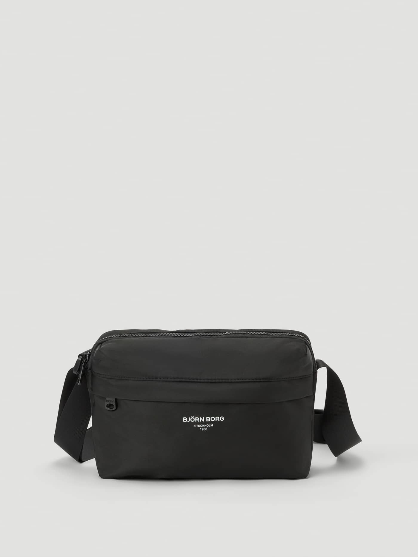 Front view of the Borg Active Crossover Bag in Black Beauty (Black), a training bag in recycled polyester with a white logo. - Image 1