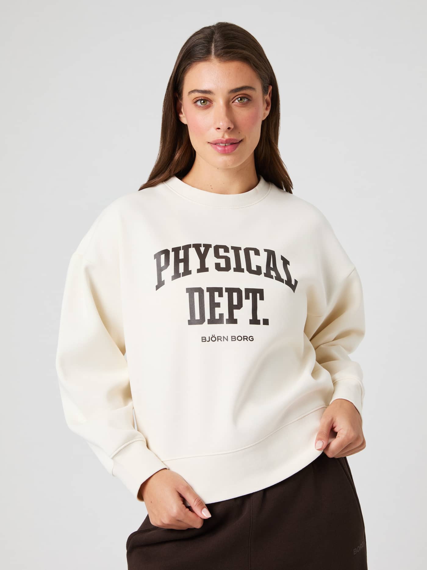 Front view of a model wearing the Tofu (White) Borg Boyfriend Sweatshirt, with a relaxed oversized fit and graphic print. - Image 5