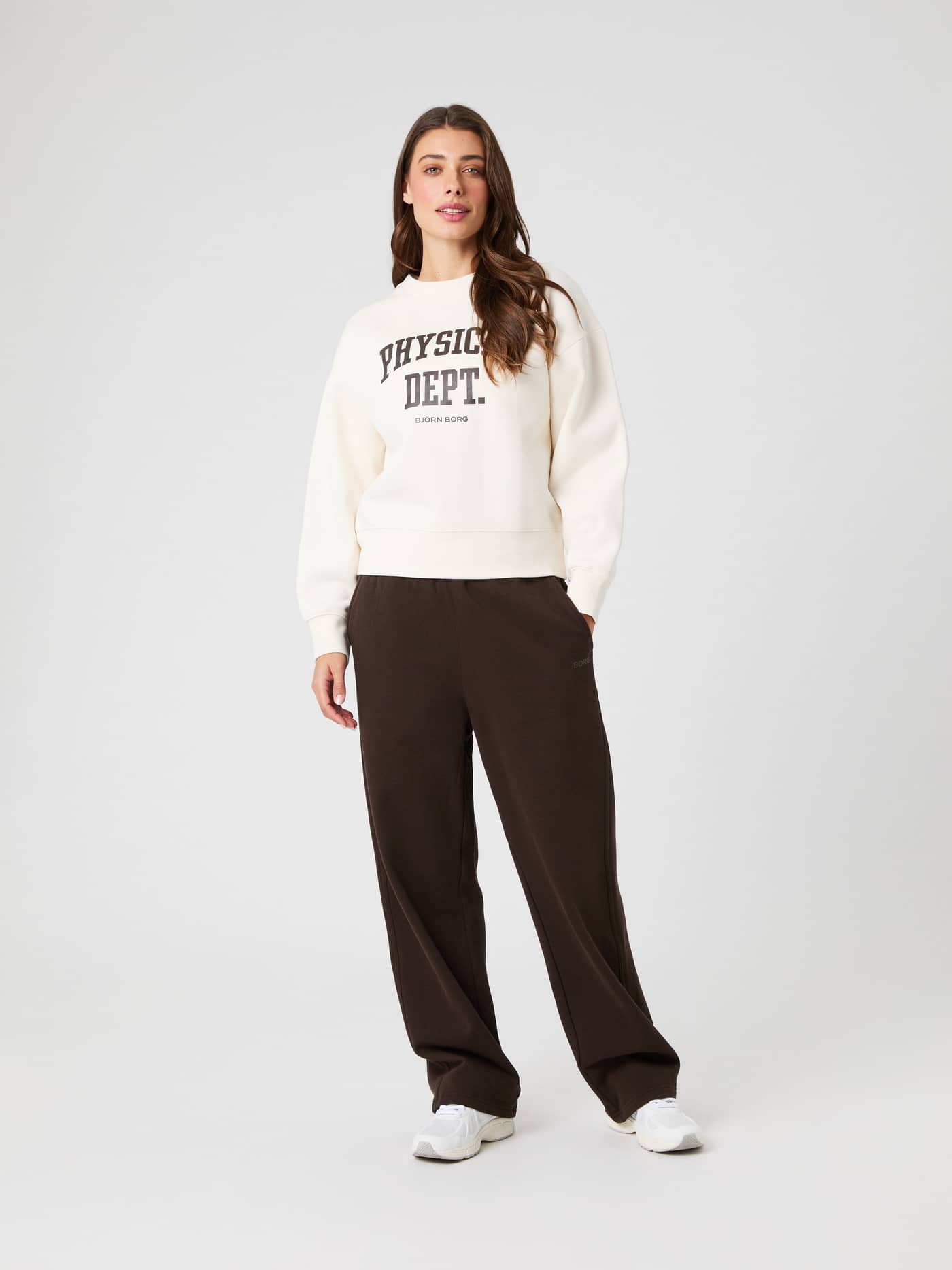 Front view of a model in the oversized Tofu (White) Borg Boyfriend Sweatshirt with dropped shoulders and a dark logo. - Image 4