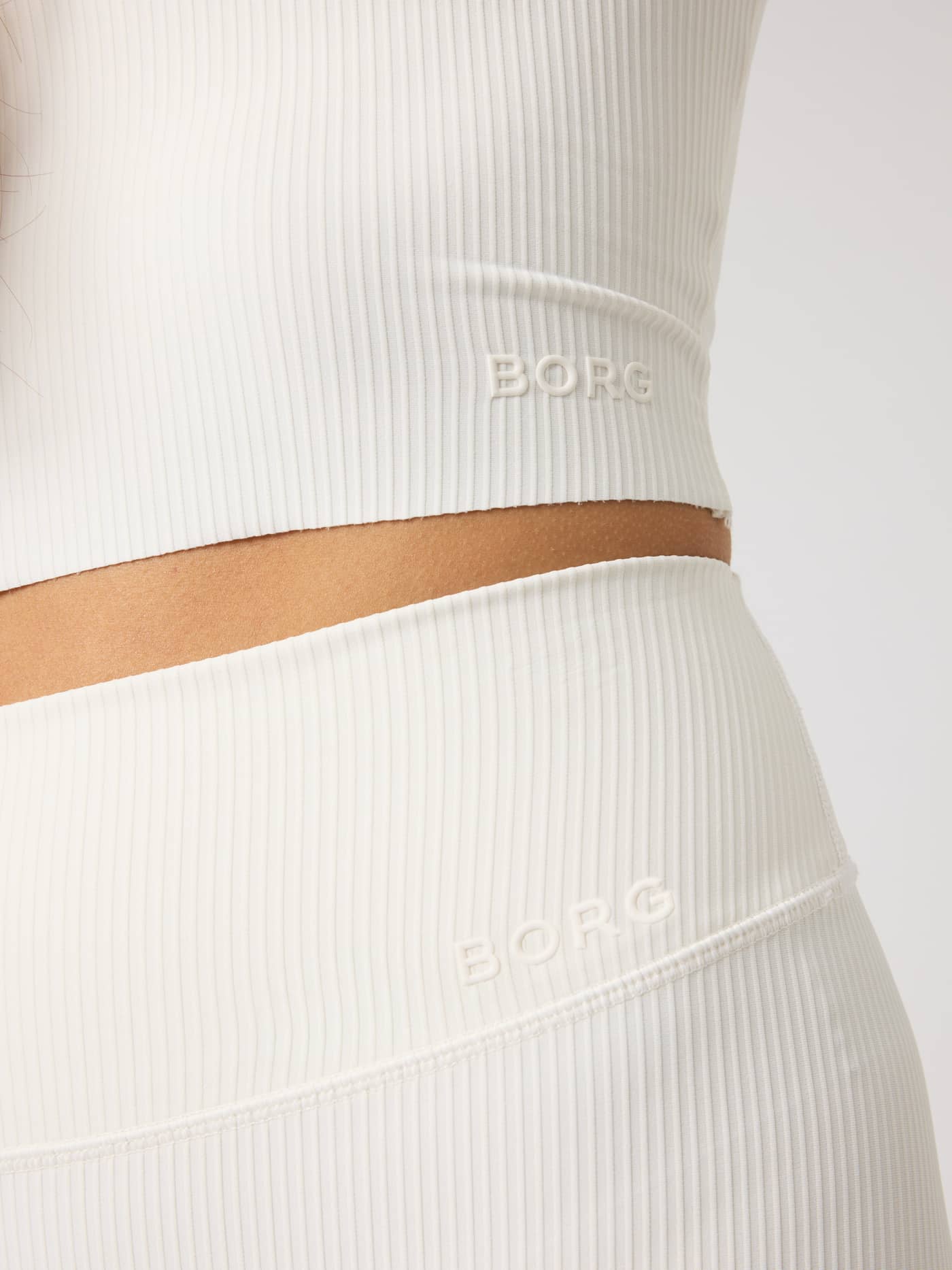 Studio Ribbed Cropped Tank Top in Tofu (White) with a ribbed texture and white BORG logo for training. - Image 5