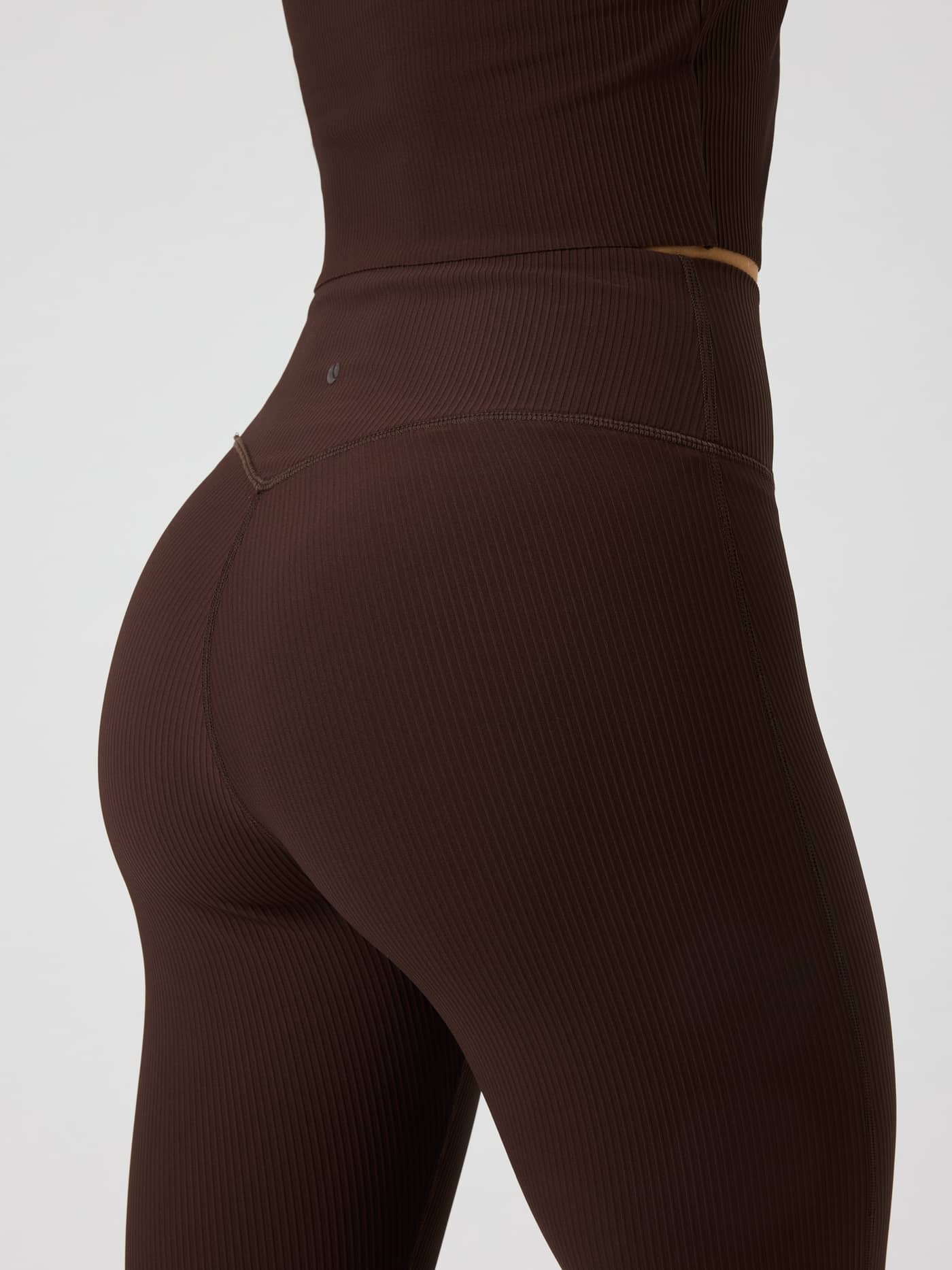Studio Ribbed Flare Tights Regular in Coffee Bean (Brown) with a ribbed texture and dark tennis ball print for training. - Image 4
