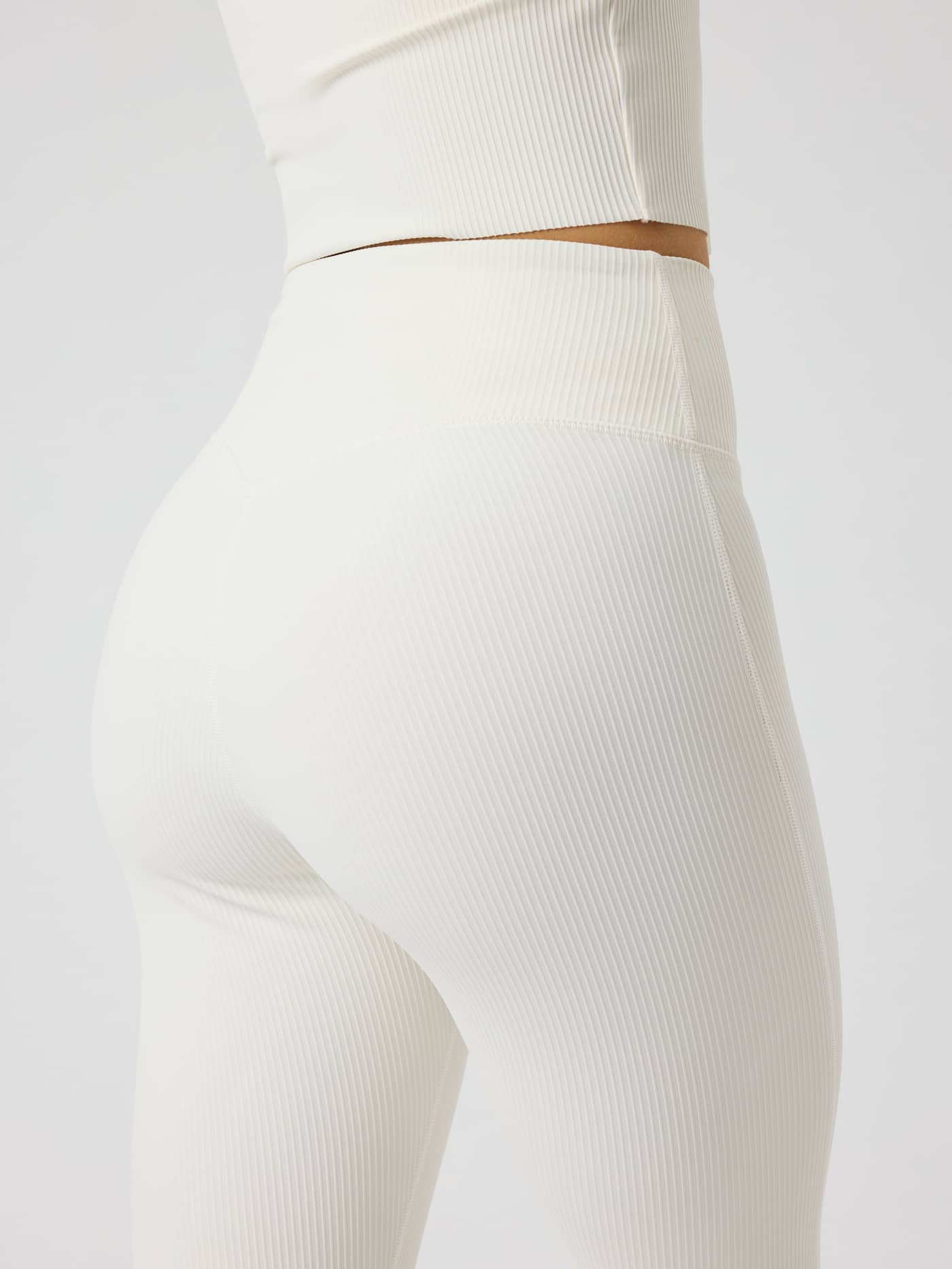 Studio Ribbed Flare Tights Regular in Tofu (White) featuring a high waist and technical ribbed fabric for training. - Image 4