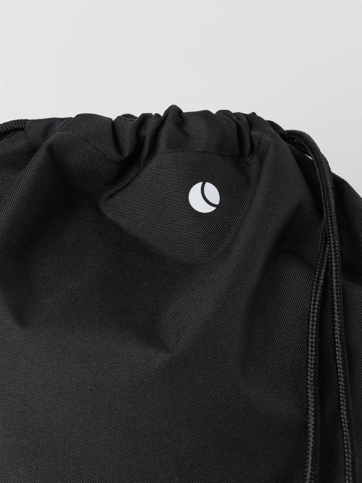 Close-up of the Borg Logo Drawstring Bag in Black Beauty (Black) with a white logo and recycled polyester for training. - Image 2