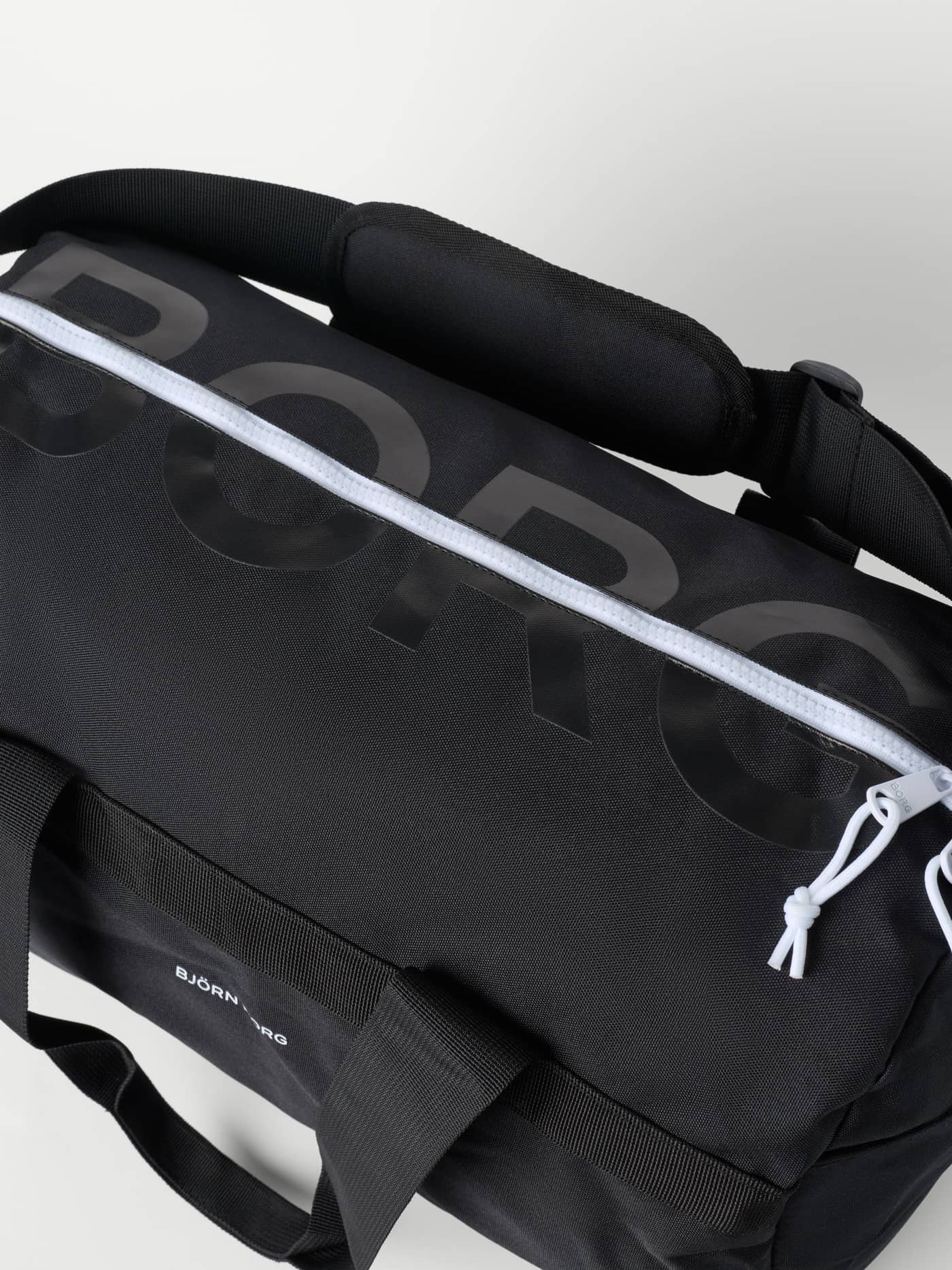 Detailed close-up of the recycled polyester Borg Logo Sports Bag 35L in Black Beauty (Black) for training with tonal logos. - Image 3
