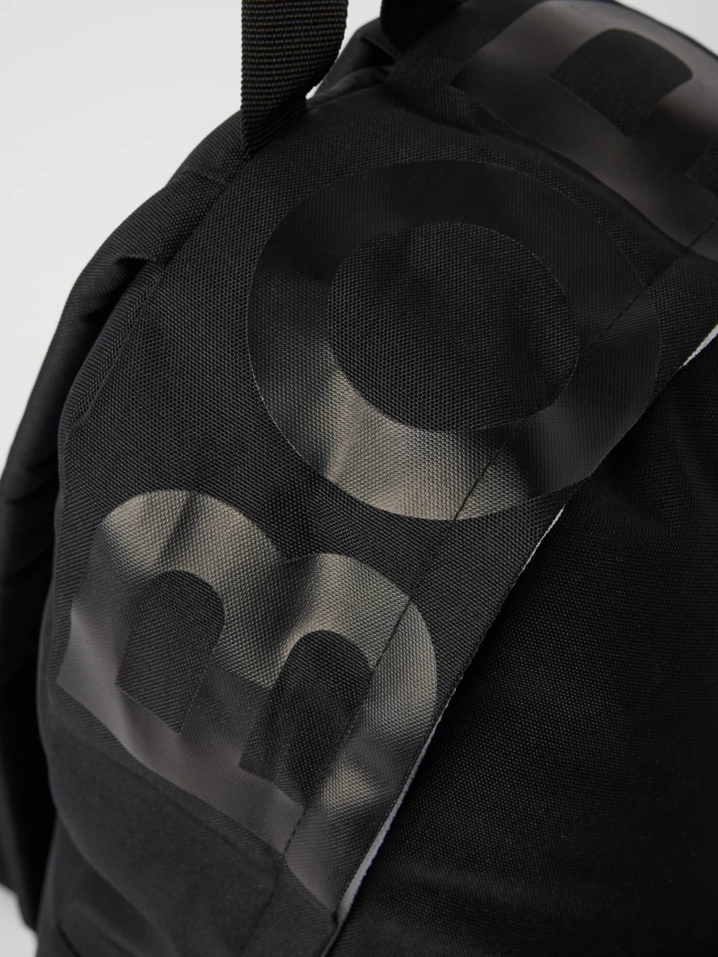 Detailed close-up of the Borg Logo Backpack 20L in Black Beauty (Black), a training bag with a large tonal logo. - Image 3