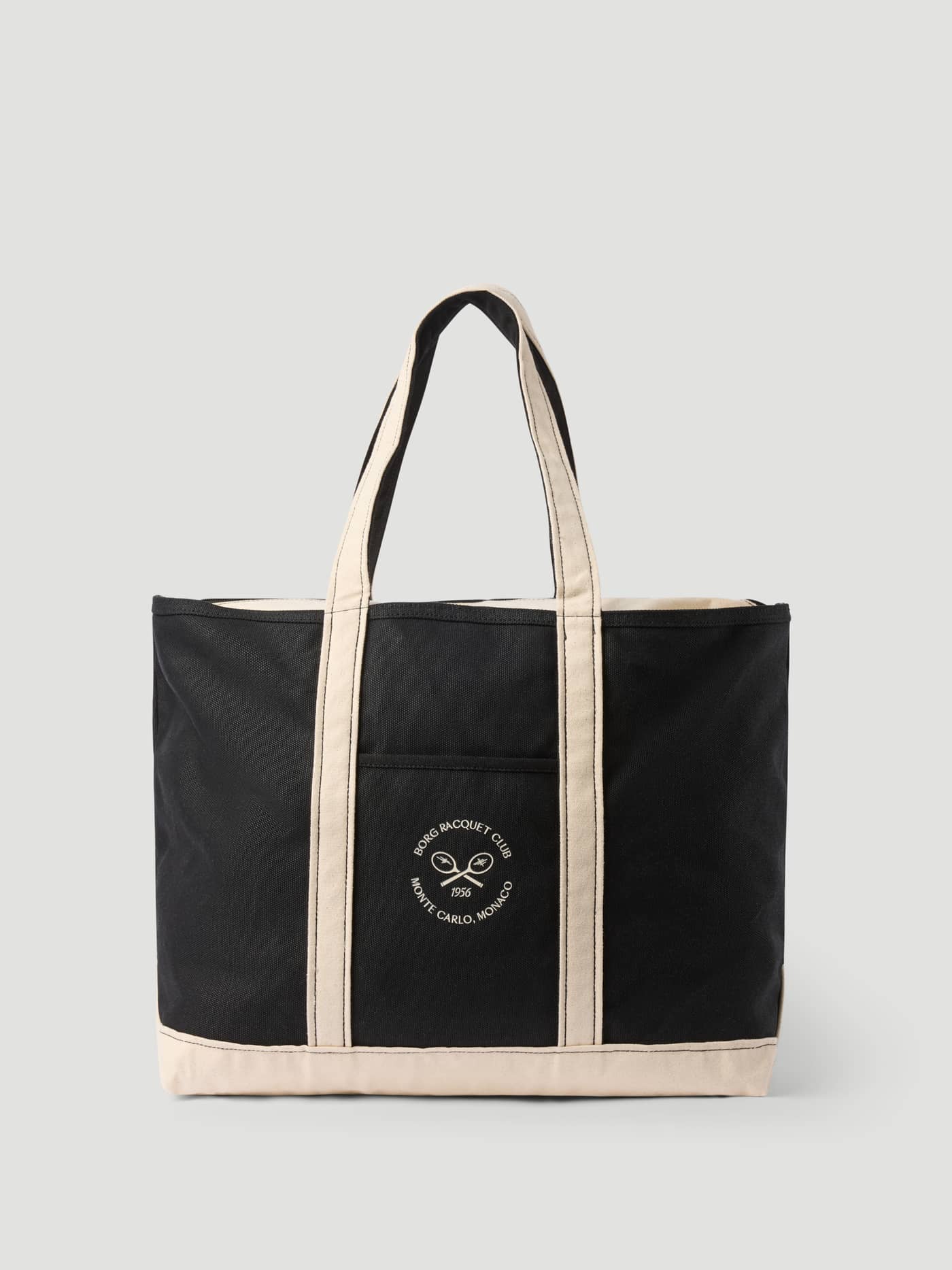 Ace Canvas Tote 30L in Black Beauty (Zwart) van katoen canvas met een wit tennislogo in vooraanzicht. - Image 1
