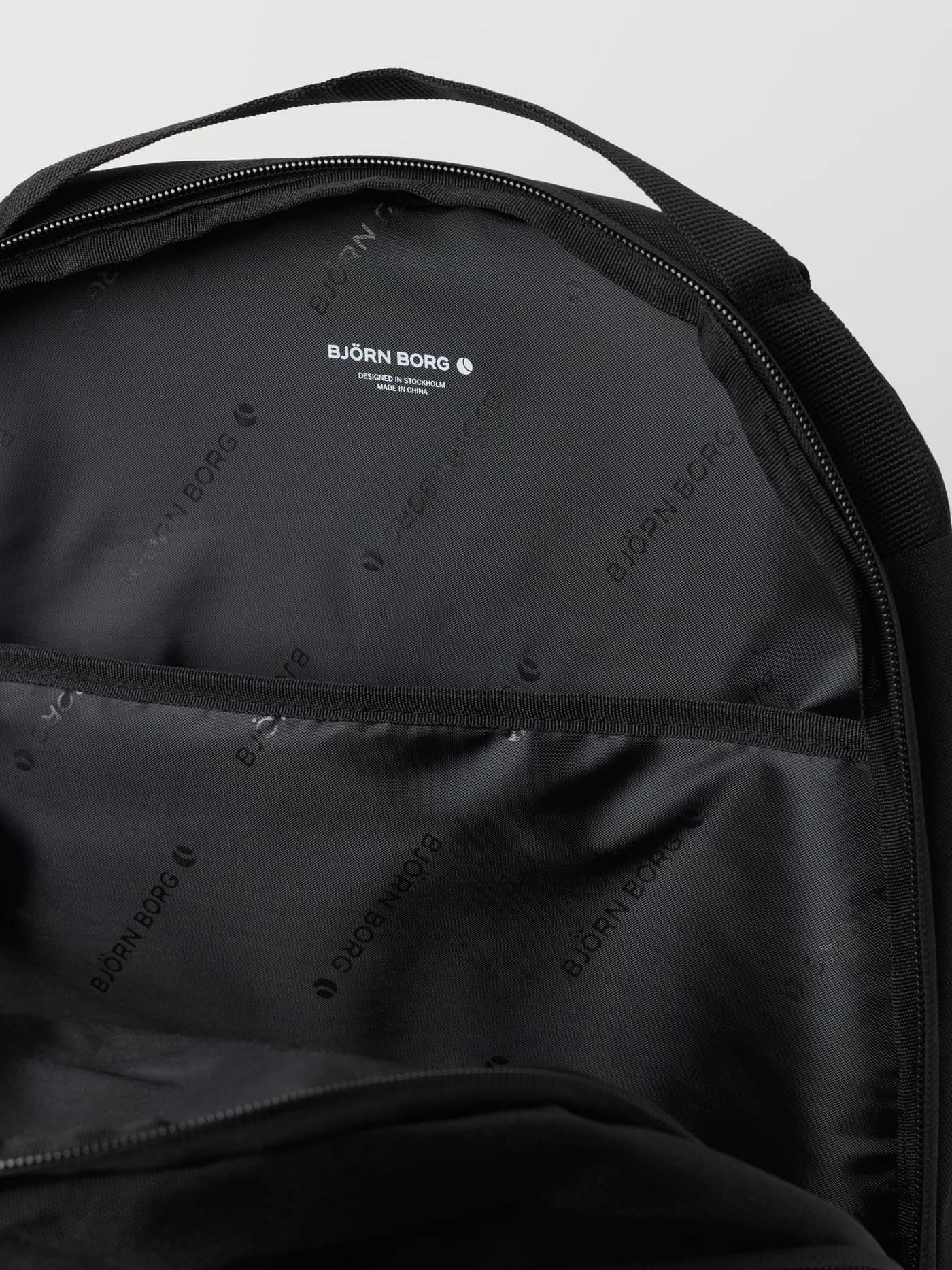 Close-up of the branded logo lining inside the training Björn Borg Logo Backpack 28L in Black Beauty (Black). - Image 3