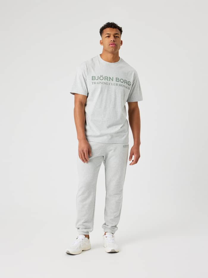 Front view of a man in tennis-inspired Borg Classic Print Sweatpants, Ultra Light Grey Melange (Grey), with a regular fit.