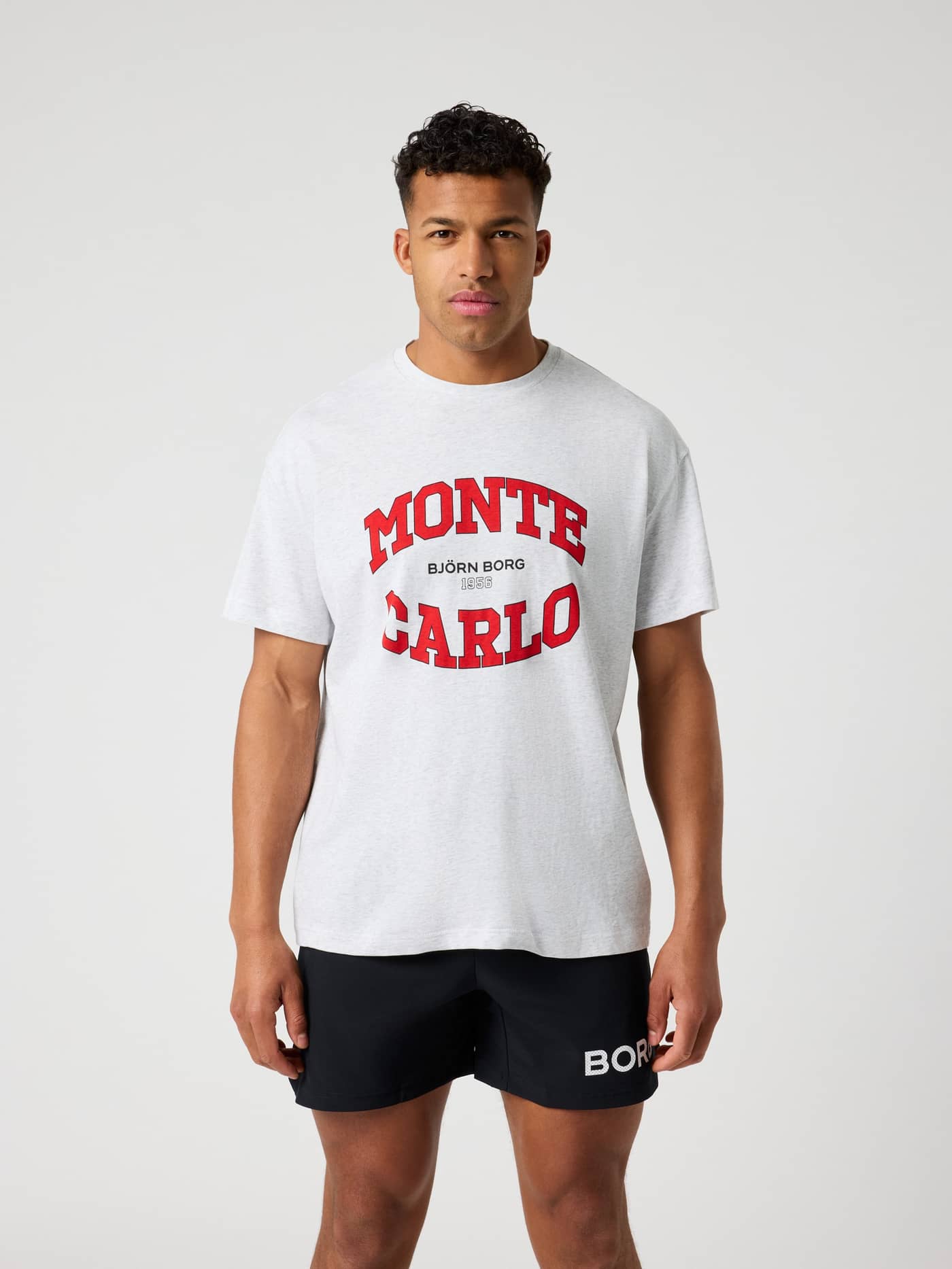 Front view of the Borg Gym Oversized T-Shirt in Ultra Light Grey Melange (Grey) for training with red chest graphics. - Image 1