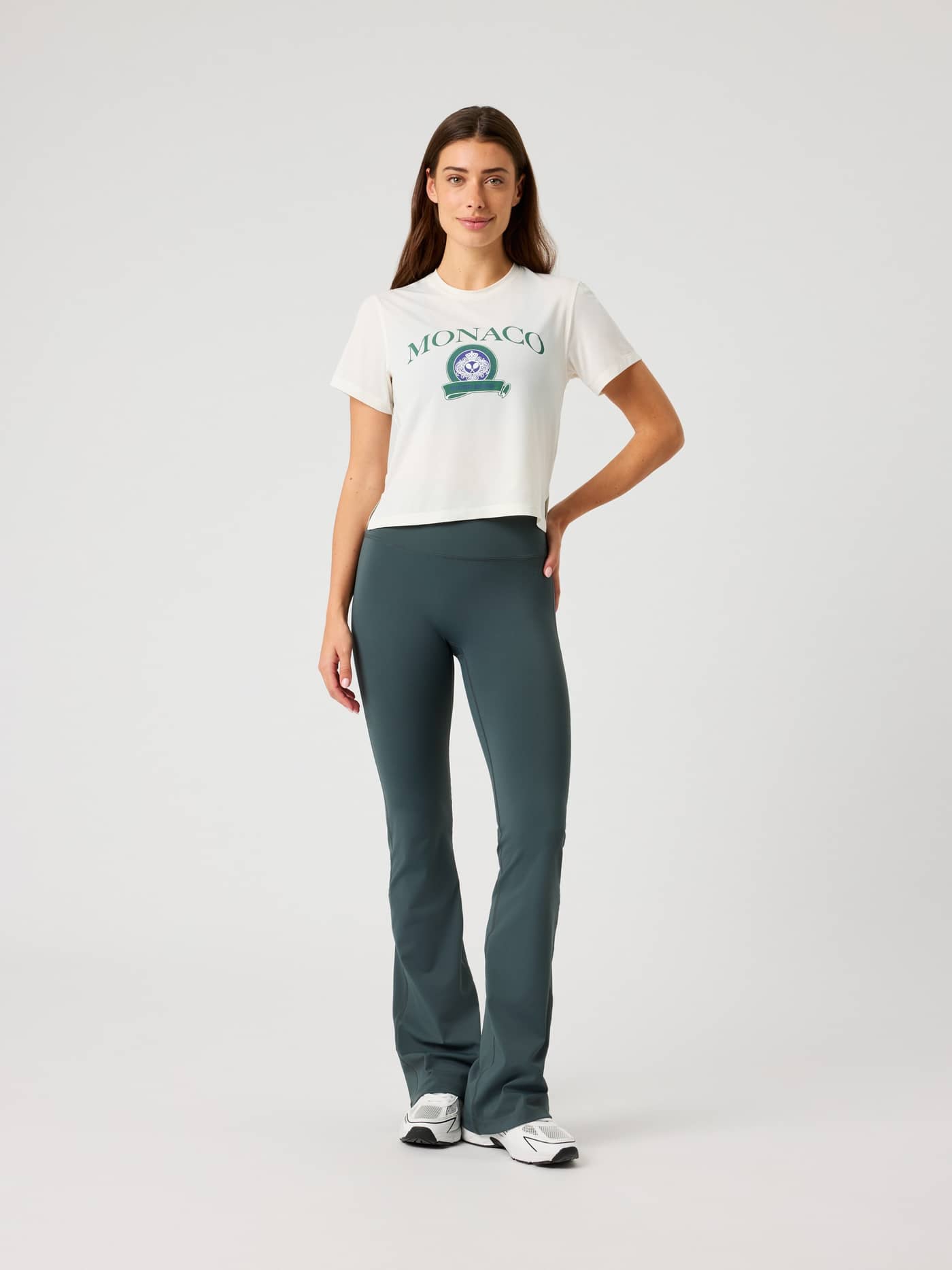 Full-body front view of a woman wearing the Borg Cropped T-Shirt in Tofu (White) featuring a stylish oversized training fit. - Image 3