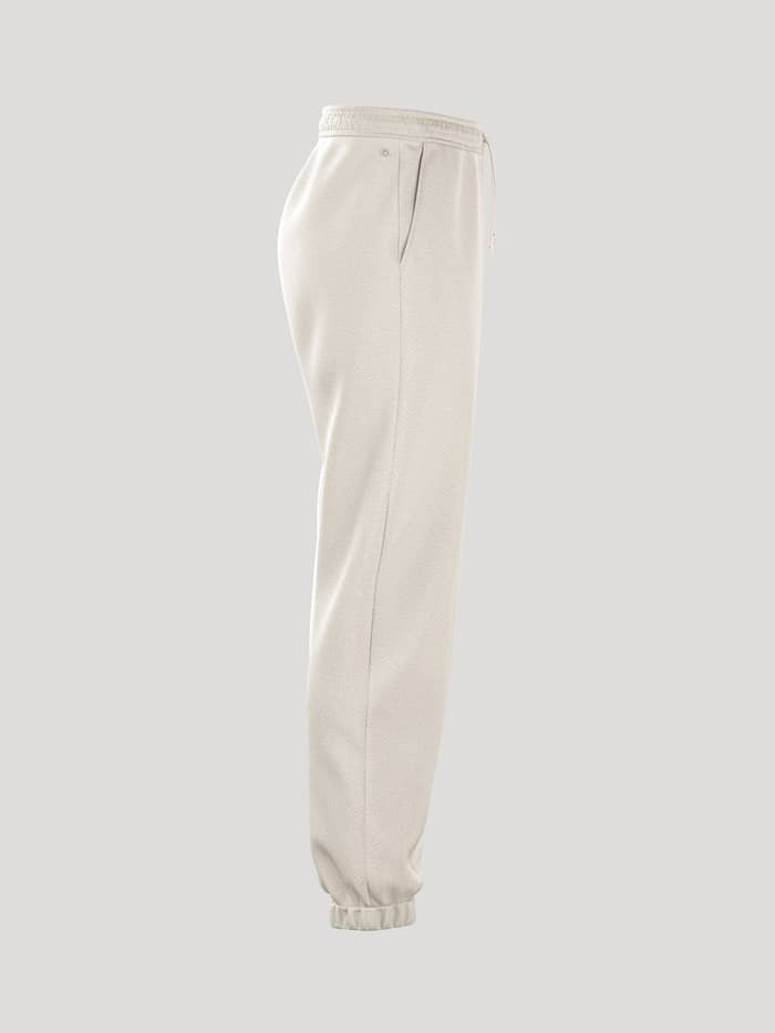 Borg Essential 4 Sweatpants i Tofu (Hvid) set fra siden med en løs pasform og ribstrikkede kanter til kvinder. - Image 2