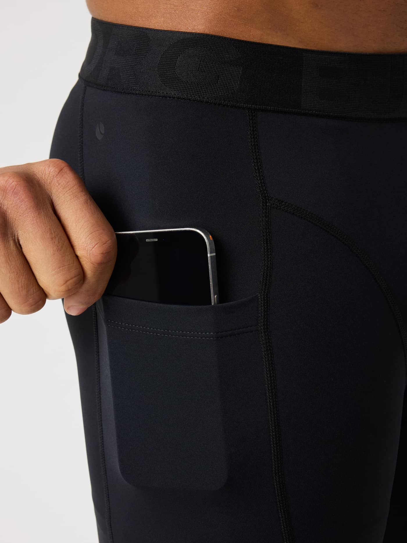 Detailed side view of the Borg Short Training Tights in Black Beauty (Black) featuring a phone pocket for training. - Image 5