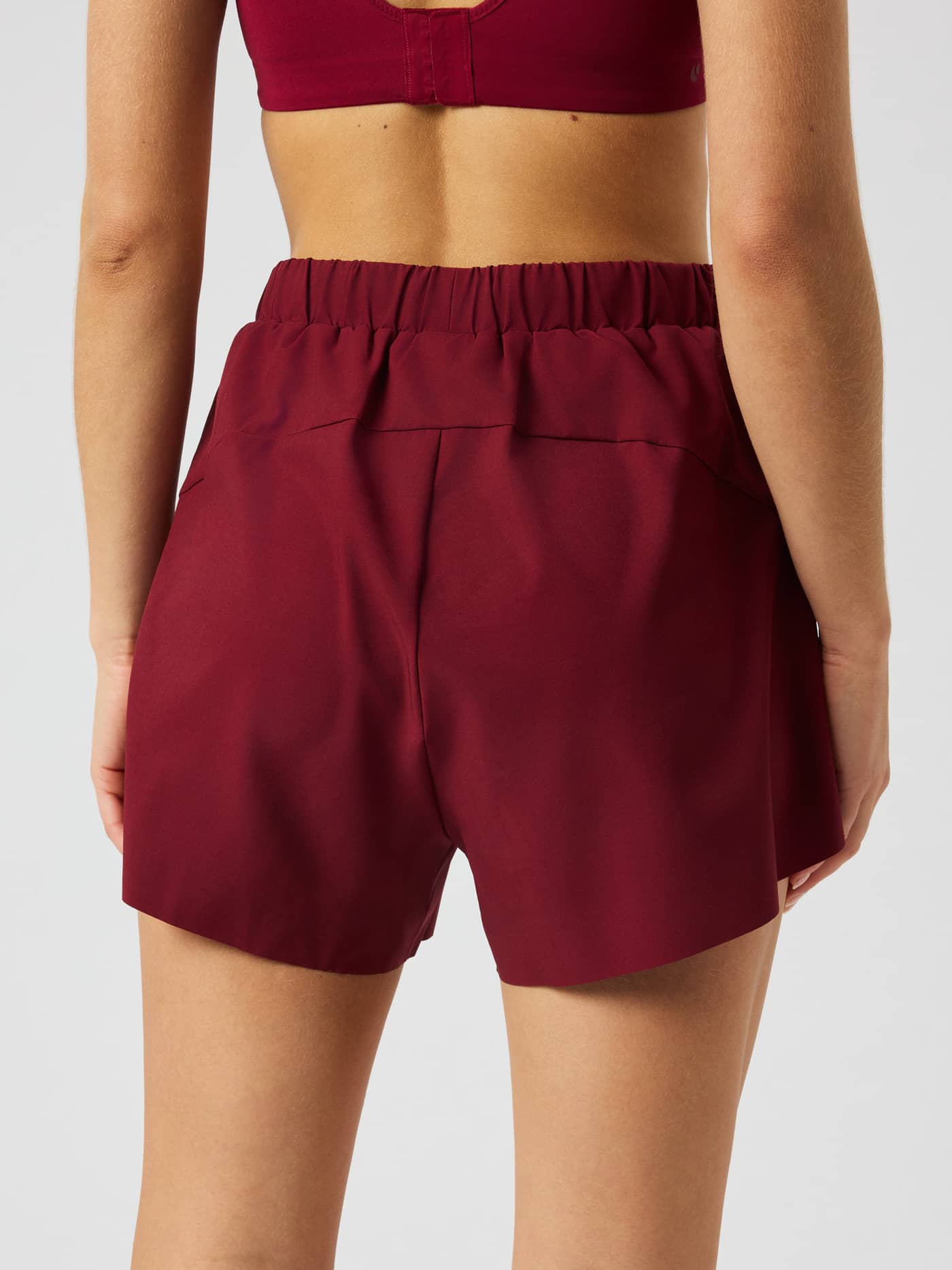 Back view of the Ace 2 In 1 Shorts in Cabernet (Red). - Image 3