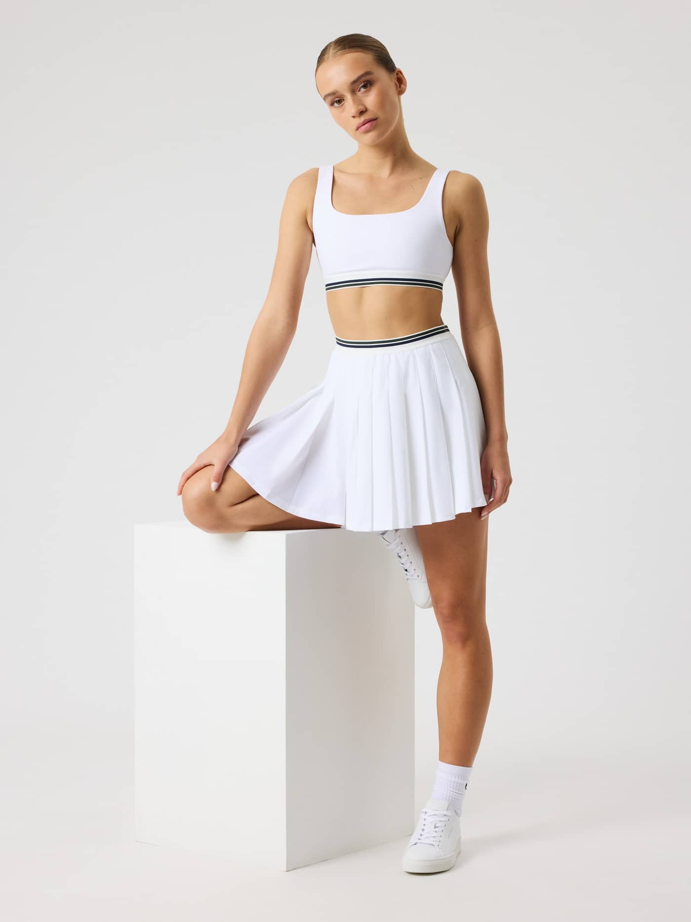 Women's Ace Court Top in Brilliant White (White), a performance tennis top with a secure fit and striped elastic waistband. - Image 8