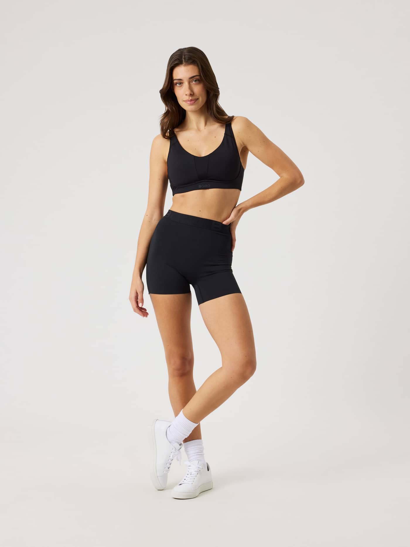 Full-body front view of a model in the Björn Borg Short Tights in Black Beauty (Black) for training and tennis performance. - Image 5