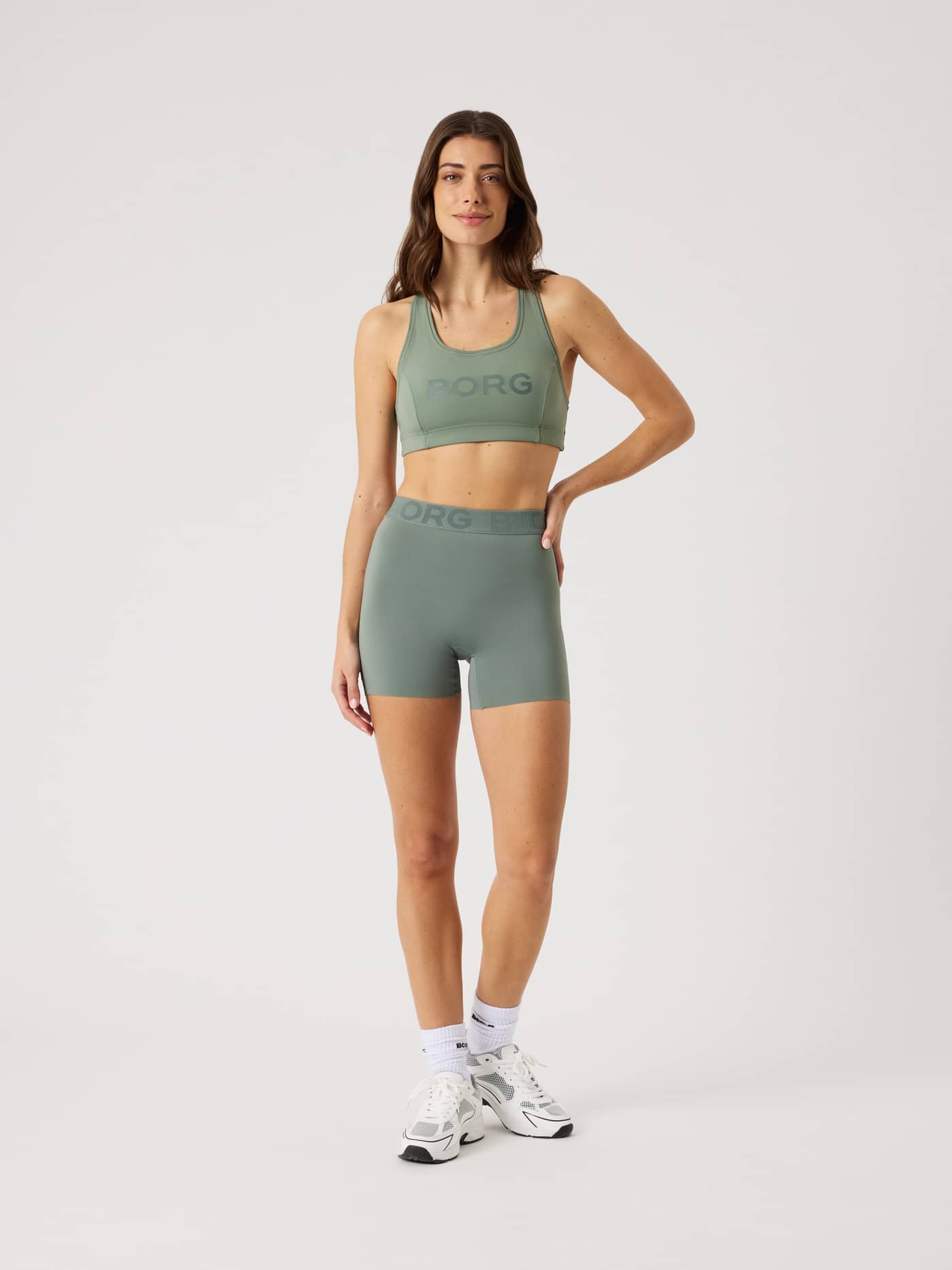 Full-body front view of a model in Agave Green (Green) Borg Short Tights, designed for training and tennis. - Image 3