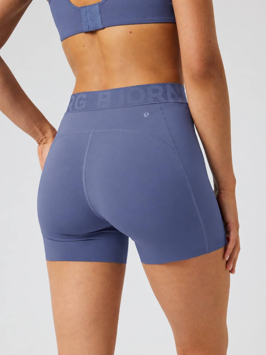 Back view of Borg Short Tights in Nightshadow Blue (Blue) with a branded waistband for tennis and training. - Image 3